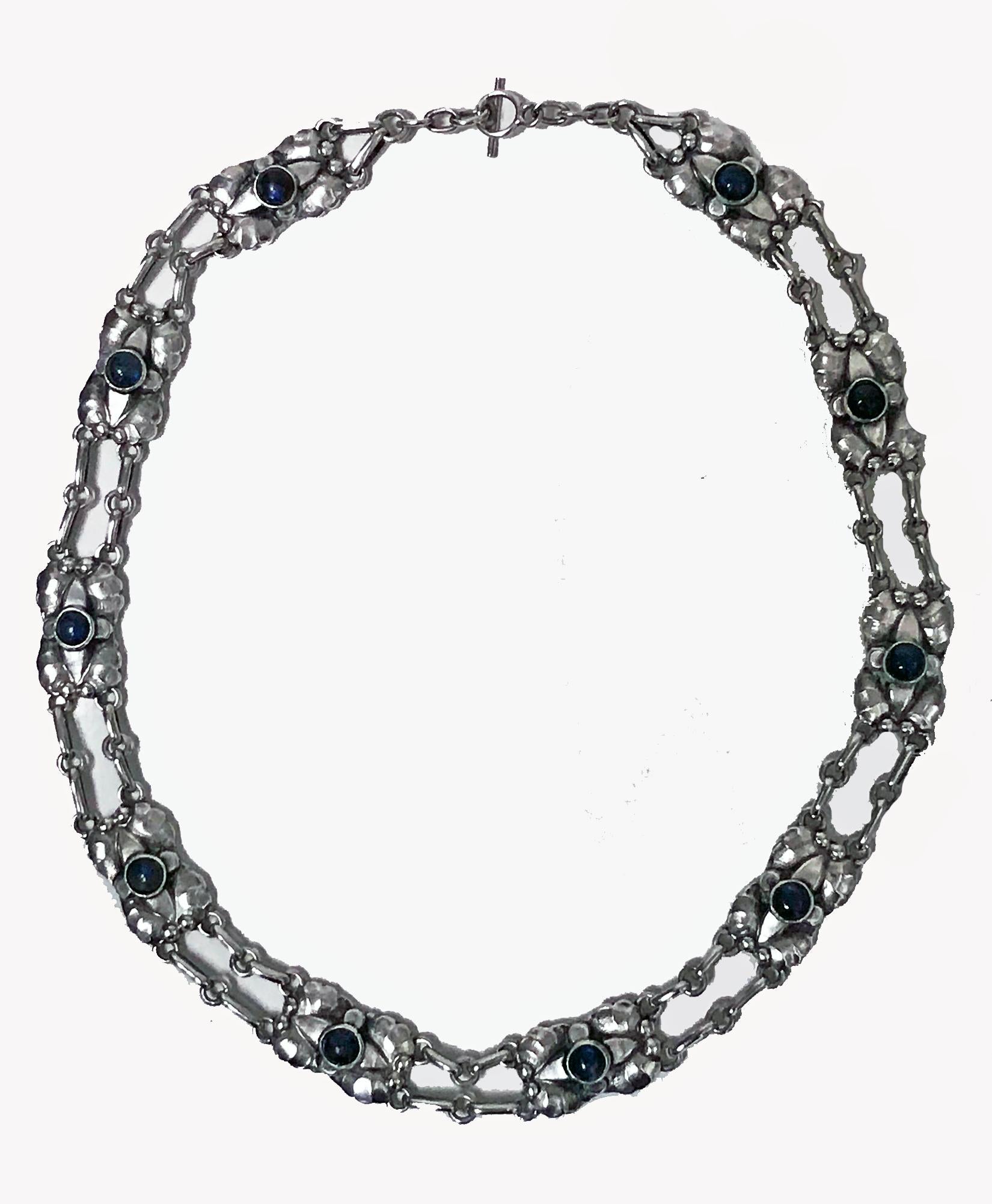 Georg Jensen rare design Silver Labradorite Necklace C.1915-30, design No 2. The Necklace composed of leaf and bud motifs centering bezel set labradorite.  Length: 16 inches. Item Weight: 37grams. Early Marks for Georg Jensen, GJ 830 standard 