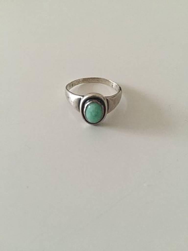 Georg Jensen Silver Ring with Green Stone No 46. In used condition. From 1933-1944. Ring Size 53 / US 6 1/2. Weighs 2.7 g / 0.09 oz.