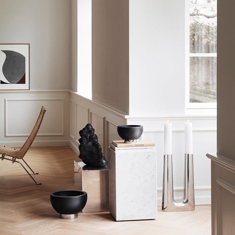 A striking example of mid-century Scandinavian minimalism, this dark ash wood and stainless steel bowl, designed originally in 1961, relies totally on its sculptural form, the contrast between materials and its superb craftsmanship. No further