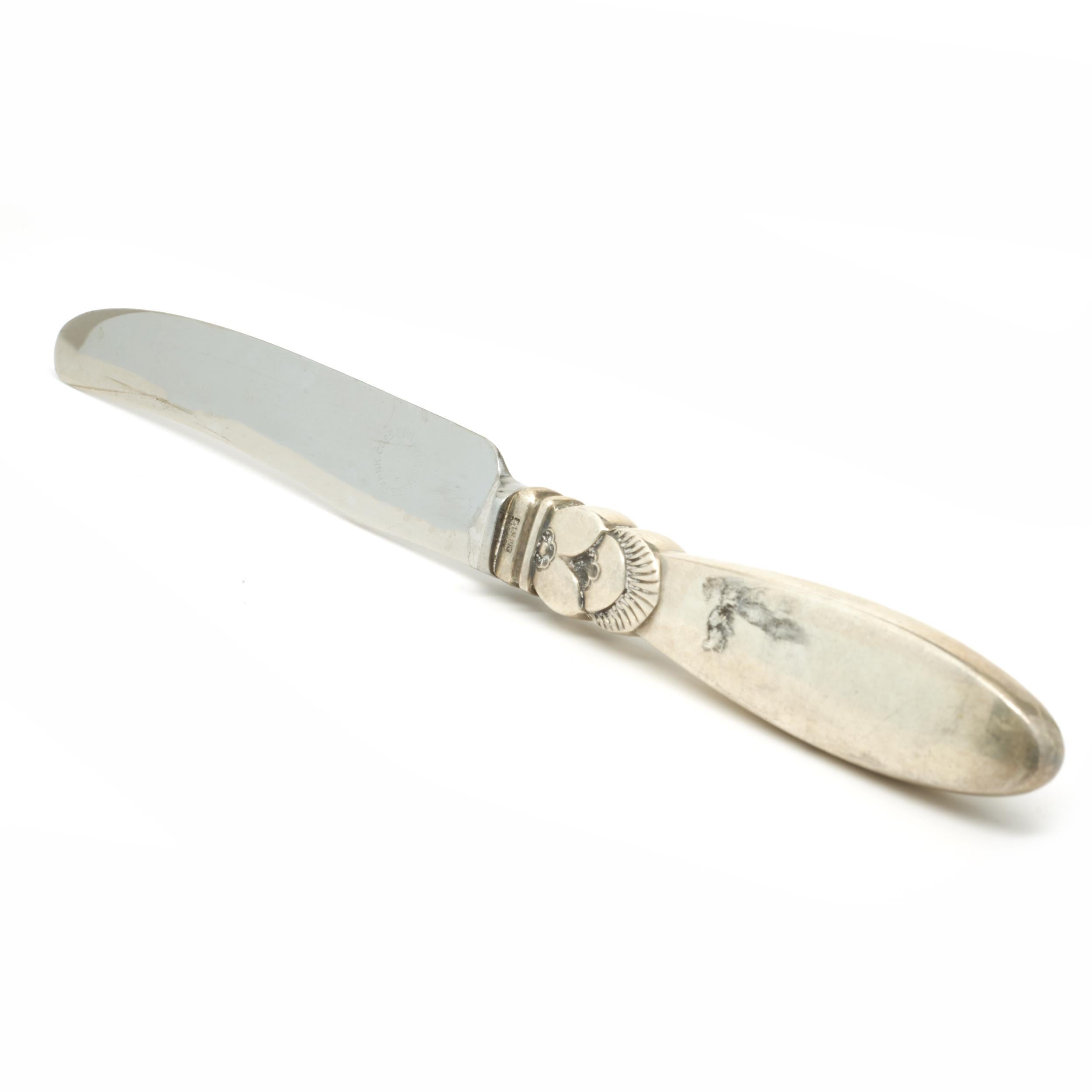 Designer: Georg Jensen
Material: stainless steel and sterling silver
Dimensions: butter knives measure 7 X 5/8”
Weight: SET = 450.83 grams

