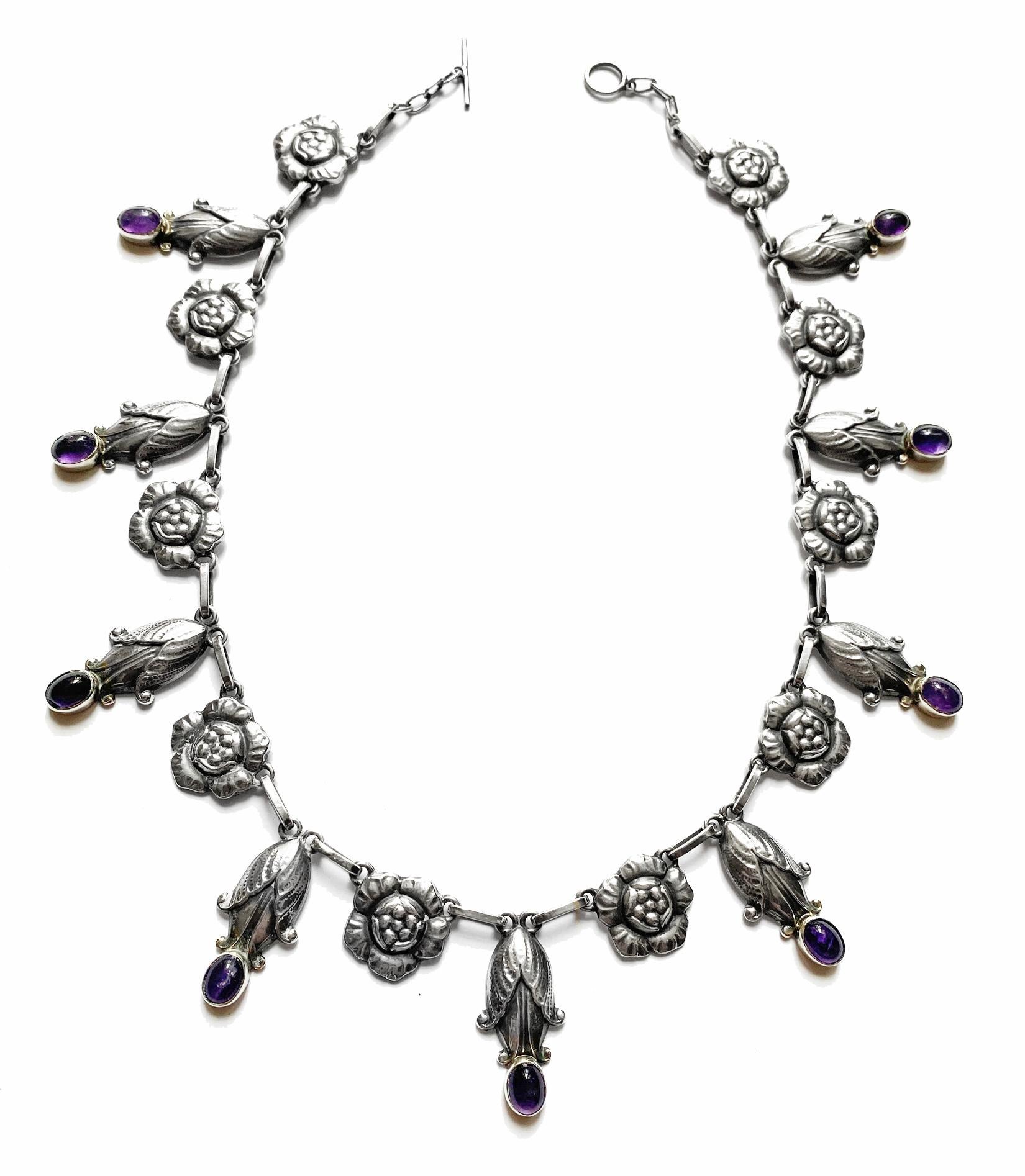 Georg Jensen rare design Sterling Amethyst Necklace C.1930, design No. 6. The Necklace composed of rosette leaf and drop bud motifs. Length: 18.00 inches. Item Weight: 56.7 grams. Marks for Georg Jensen, GJ, 925 Sterling Denmark, 6.