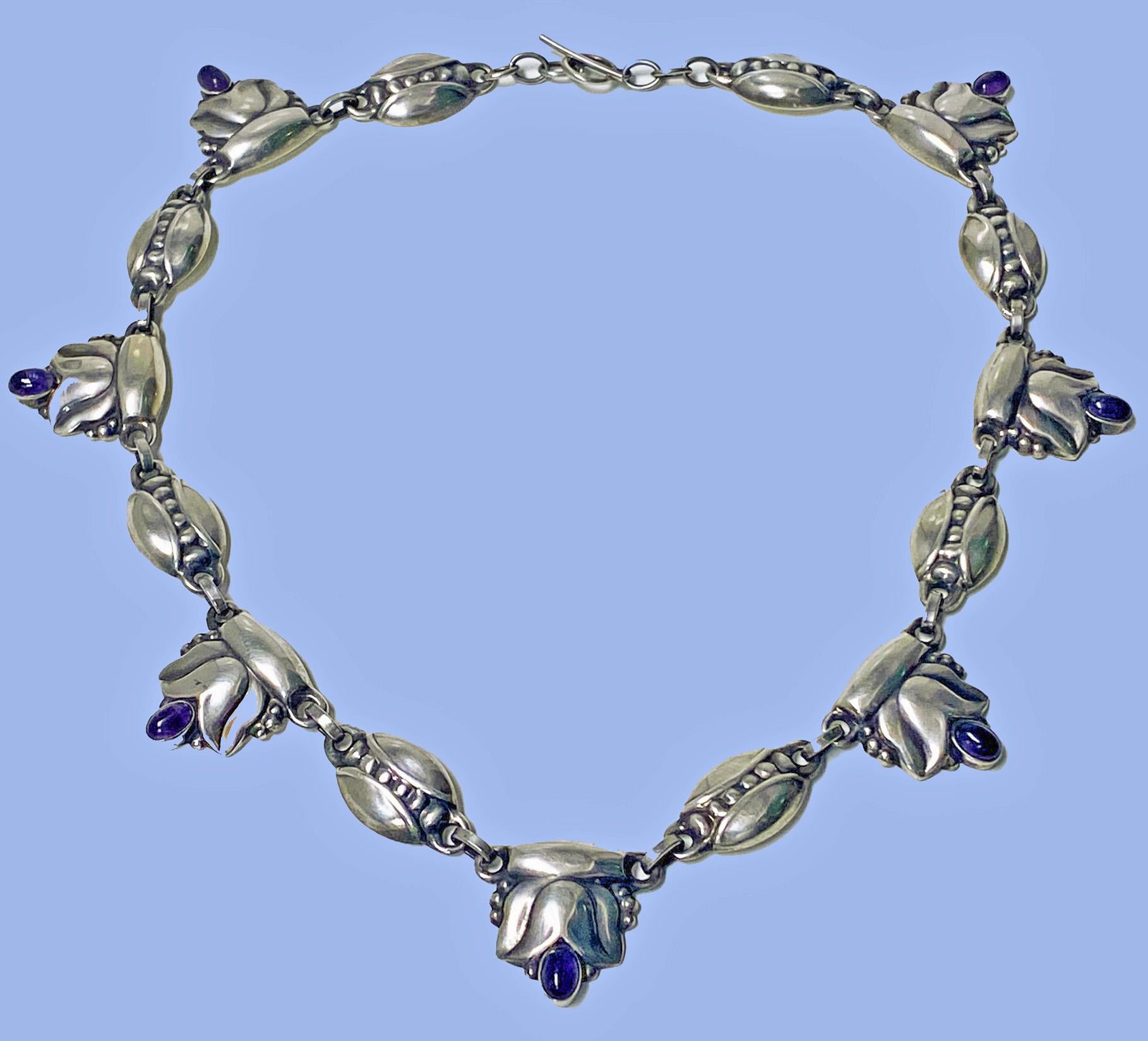 Georg Jensen rare design Sterling Amethyst Necklace C.1930, design No. 3. The Necklace composed of leaf and bud motifs. Length: 17.50 inches. Item Weight: 43.22 grams. Marks for Georg Jensen, GJ, 925 Sterling Denmark, 3. Similar example set with