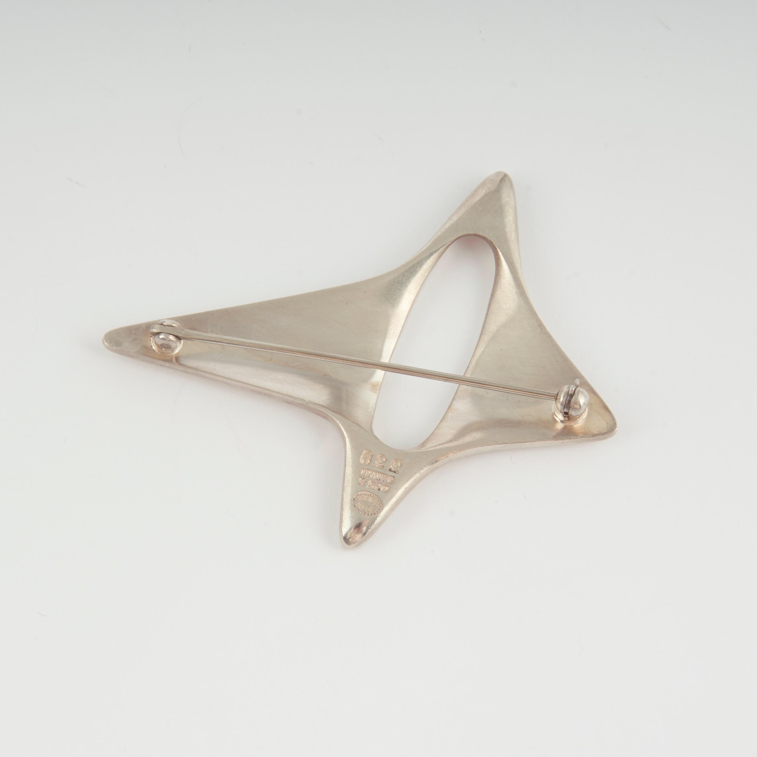 Georg Jensen Sterling Amorphic Brooch, Design #339 by Henning Koppel

Designed in 1948.

A similar example can be seen in the book, GEORG JENSEN JEWELRY by Isabelle Anscombe, edited by David A. Taylor. Yale University Press, pg. 271

Designer: