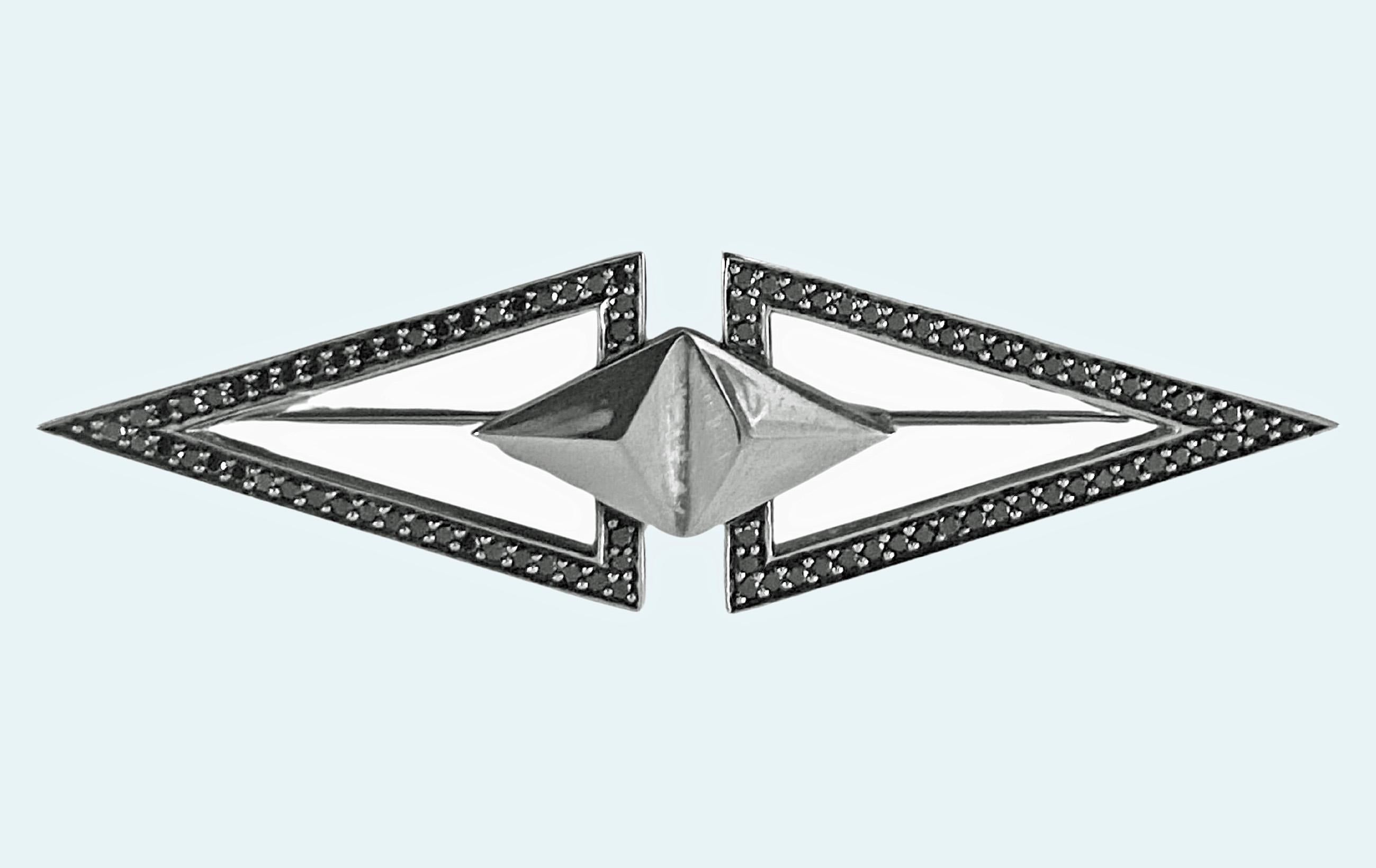 Georg Jensen Sterling and black Diamond Brooch #569C, 20th century. Designed by Regitze Overgaard for Georg Jensen. Marquise elongated shape, polished sterling double lozenge centre with open triangular equilateral side sections set with surrounds