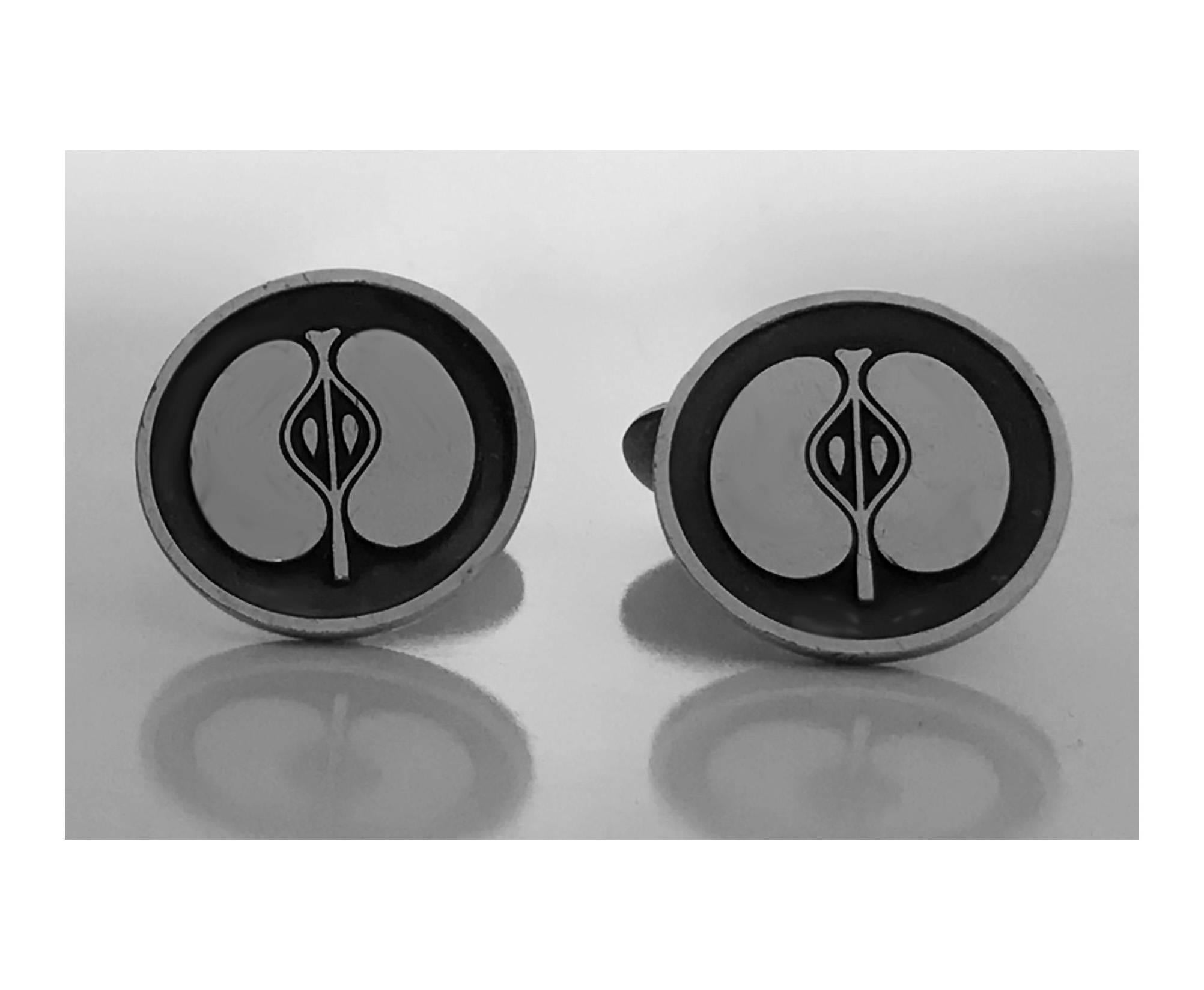 Georg Jensen Sterling `Apple’ Cufflinks, oxidised niello finish, the round sterling silver discs with raised apple motif t bar fittings , signed and numbered 111. Diameter: 7/8 inches. Item Weight: 22.16 grams.