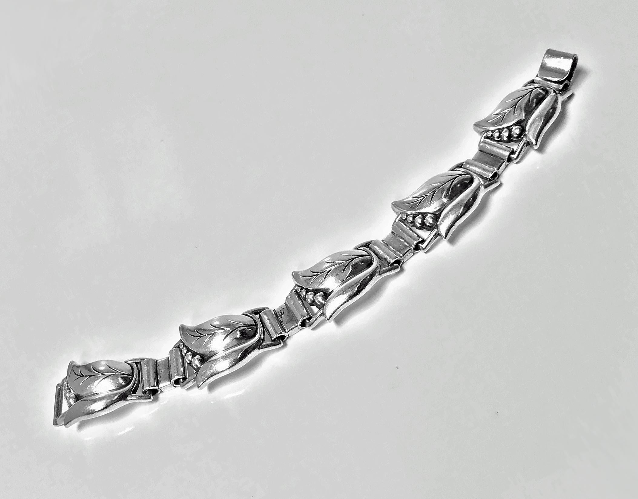 Georg Jensen Sterling Bracelet, C.1940.The Bracelet, fleur danoise design, with hinged stylised tulip bud petal links, Georg Jensen Sterling USA marks to reverse and design number 145 for La Paglia. Illustrated page 67 Jensen Silver by Schiffer and