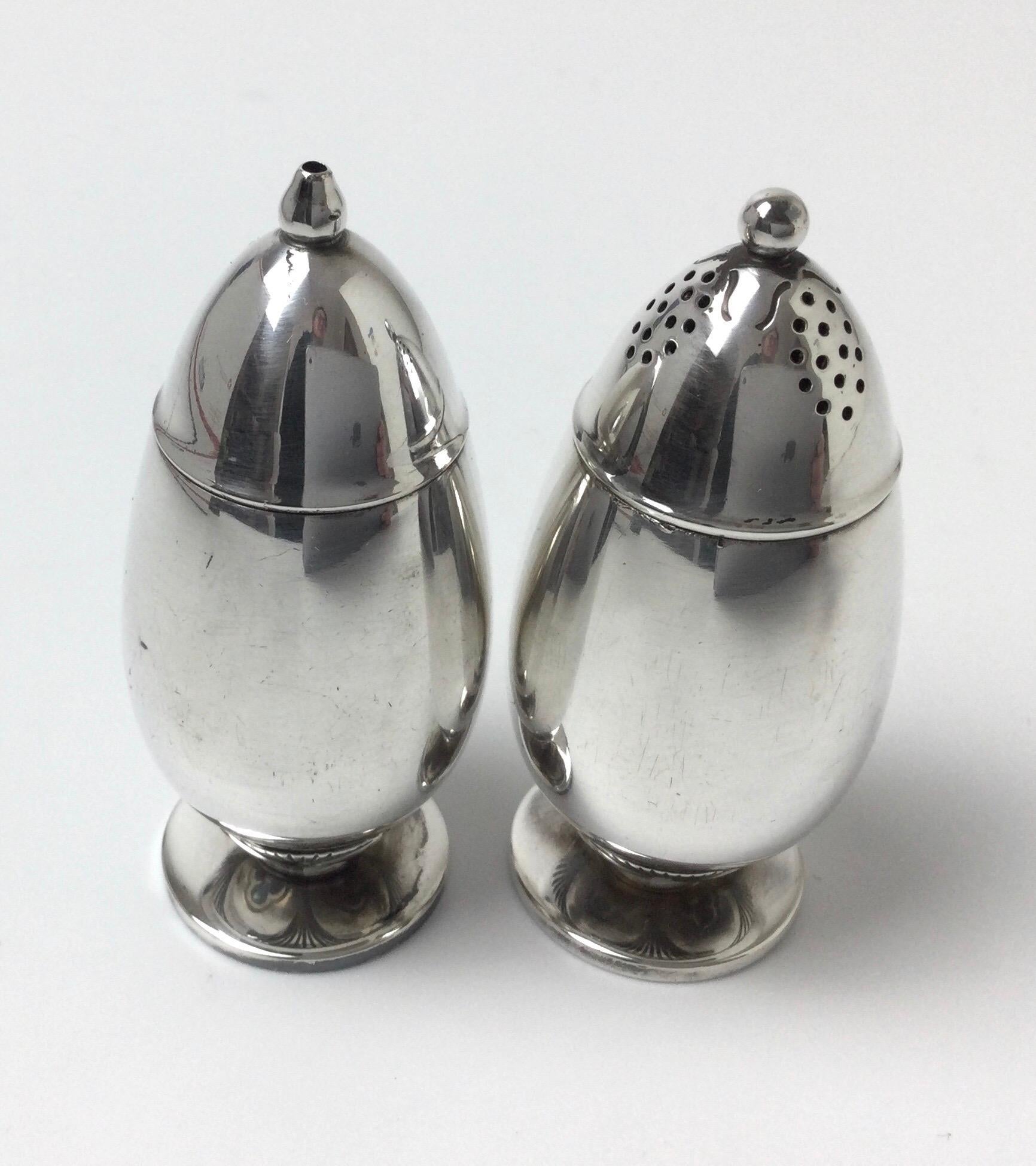Georg Jensen sterling silver salt and pepper shakers 2-piece set. The pieces are marked with 629A. Signed Dessin they measure: 2 7/8 by 1 1/4