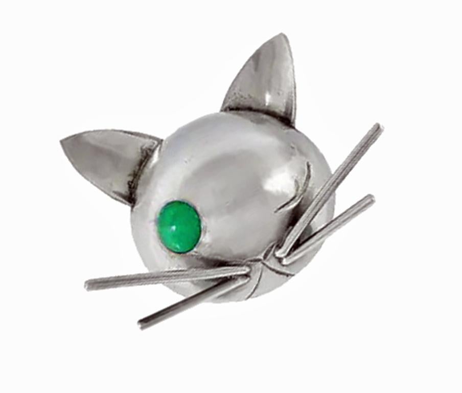 Rare Sterling Cat Brooch, Georg Jensen Inc C.1940 JoPol. Designed by Joan Polsdorfer, modernist whimsical design. The cat's head brooch, with one eye a cabochon green stone, adorned with four long whiskers. Polsdorfer was the first American jewelry