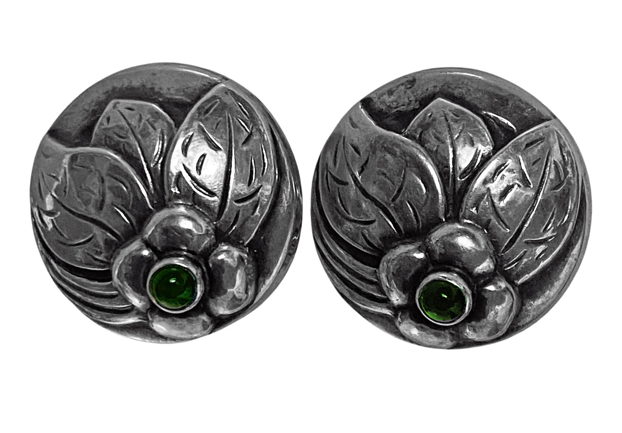 Georg Jensen chrysoprase sterling Earrings. Each of round three dimensional open petal bud form and bezel set at base with small cabochon chrysoprase. Diameter:18 mm. Later post fitments with silicone stoppers. Full Georg Jensen marks to reverse.