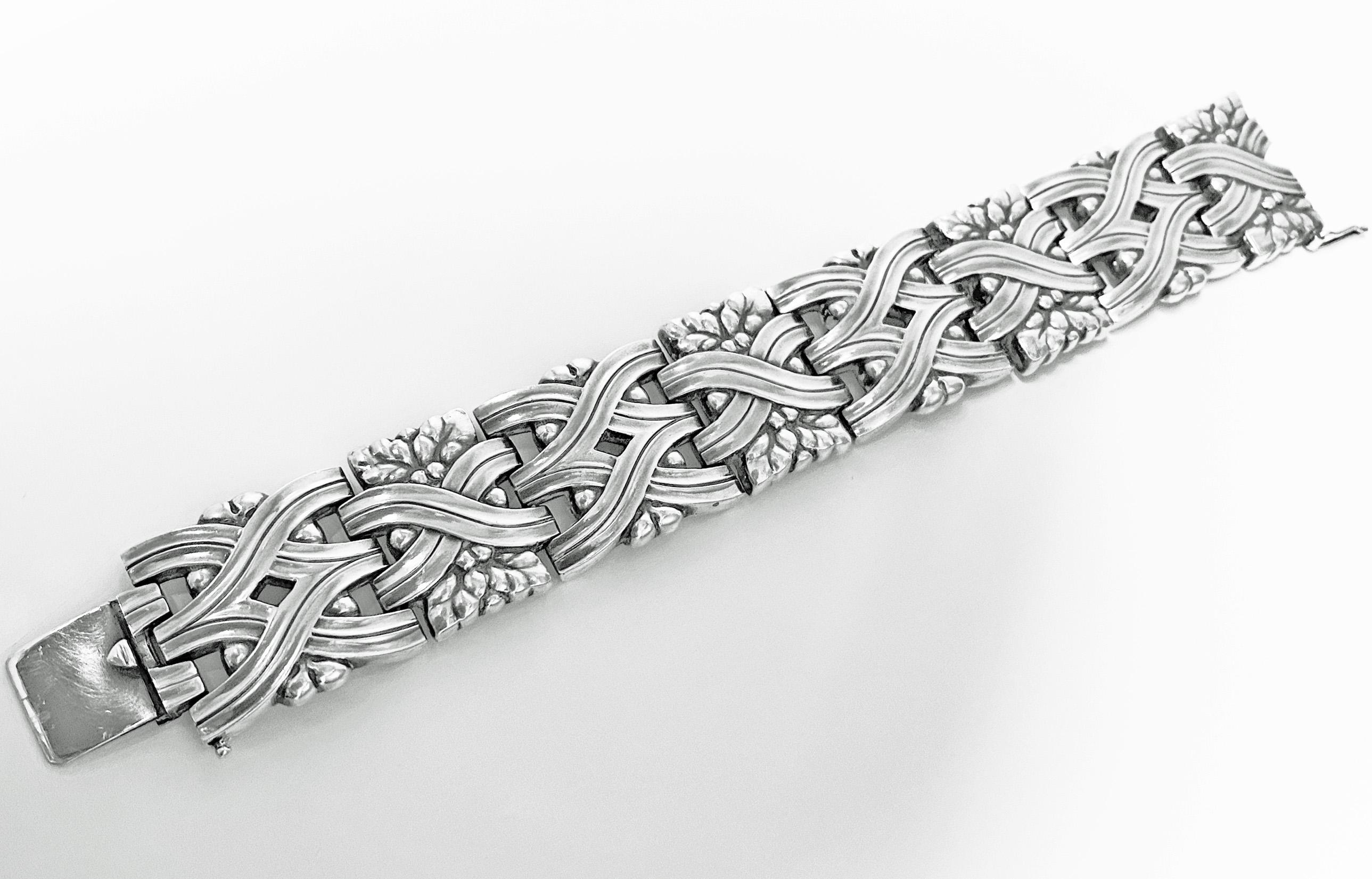 Georg Jensen Sterling rare design Bracelet 1933-1944. Designed by Harald Nielsen for Georg Jensen, designed as interlocking bands with foliate motifs, Viking inspired Design no. 83, Georg Jensen hallmark from 1933-1944 GJ in box. Length: 7.25