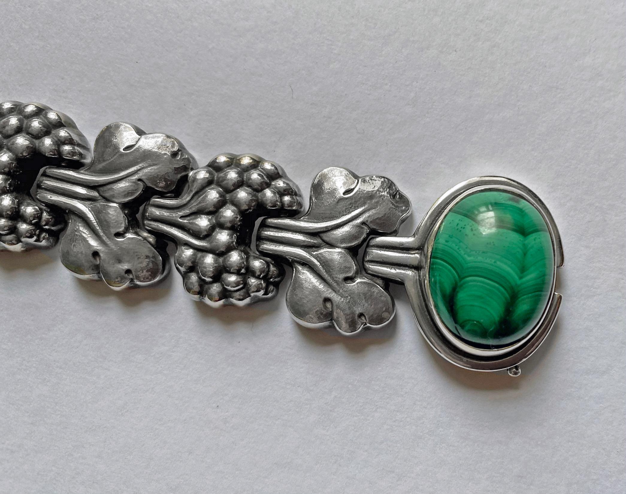 An extremely Rare Georg Jensen Sterling Silver PARIS Bracelet No 30, Denmark C.1945. Set with a large oval cabochon Malachite stone. A similar example with amber is featured in Drucker reference Georg Jensen , A Tradition of Splendid Silver, P 97.