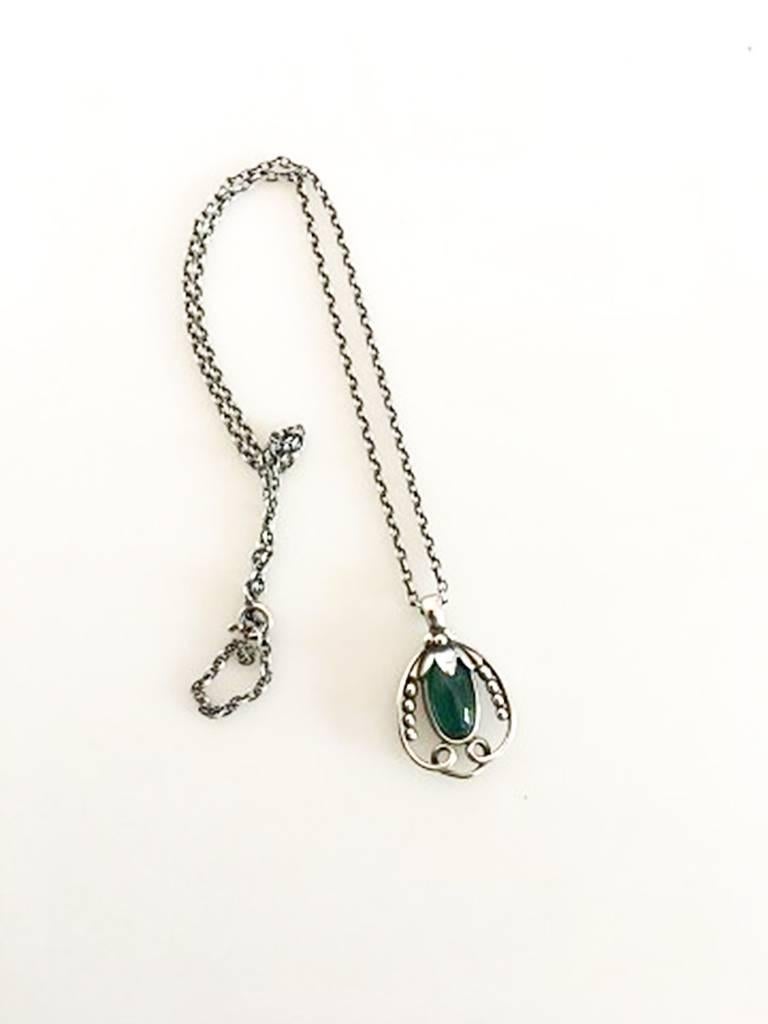 Georg Jensen Sterling Silver 1990 Annual Pendant with Green Agate and Chain. Chain measures 45.5 cm / 17 29/32 in. Pendant measures 3 cm / 1 3/16 in. Weighs 9.6 g / 0.34 oz.