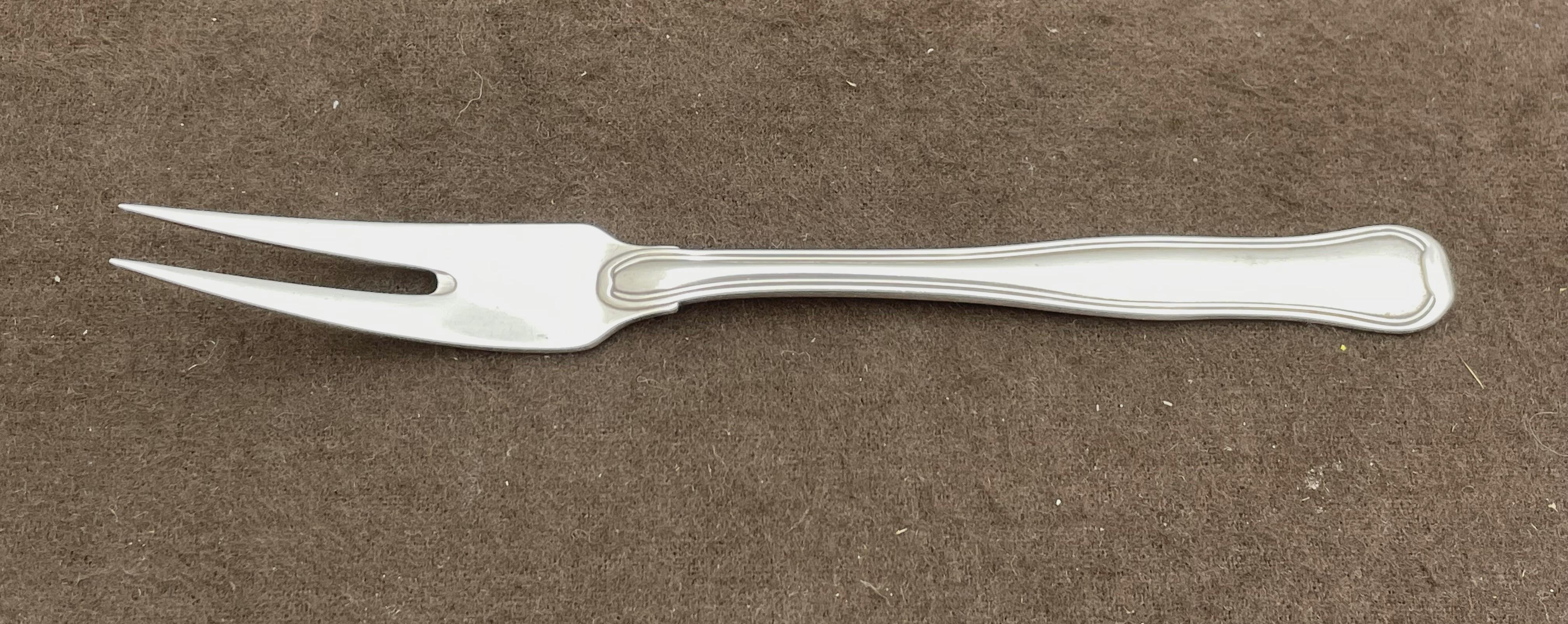 Georg Jensen sterling silver flatware set in Old Danish pattern, in an elegant, Mid-Century Modern style, consisting of:

- a two-tine fork measuring 6 3/4'' in length

- a sauce ladle measuring 7 1/2'' in length

- a 2-piece salad server consisting