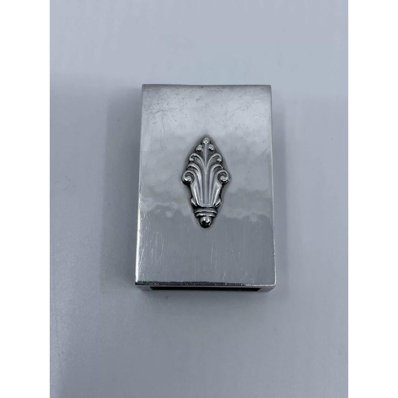 A Georg Jensen Sterling Silver  Match Box Holder in the Acanthus pattern, design #68c by Johan Rohde from 1917.

Additional information:
Material: Sterling silver
Hallmarks: Vintage 1920/1930s Georg Jensen hallmark, “GI 925s STERLING
