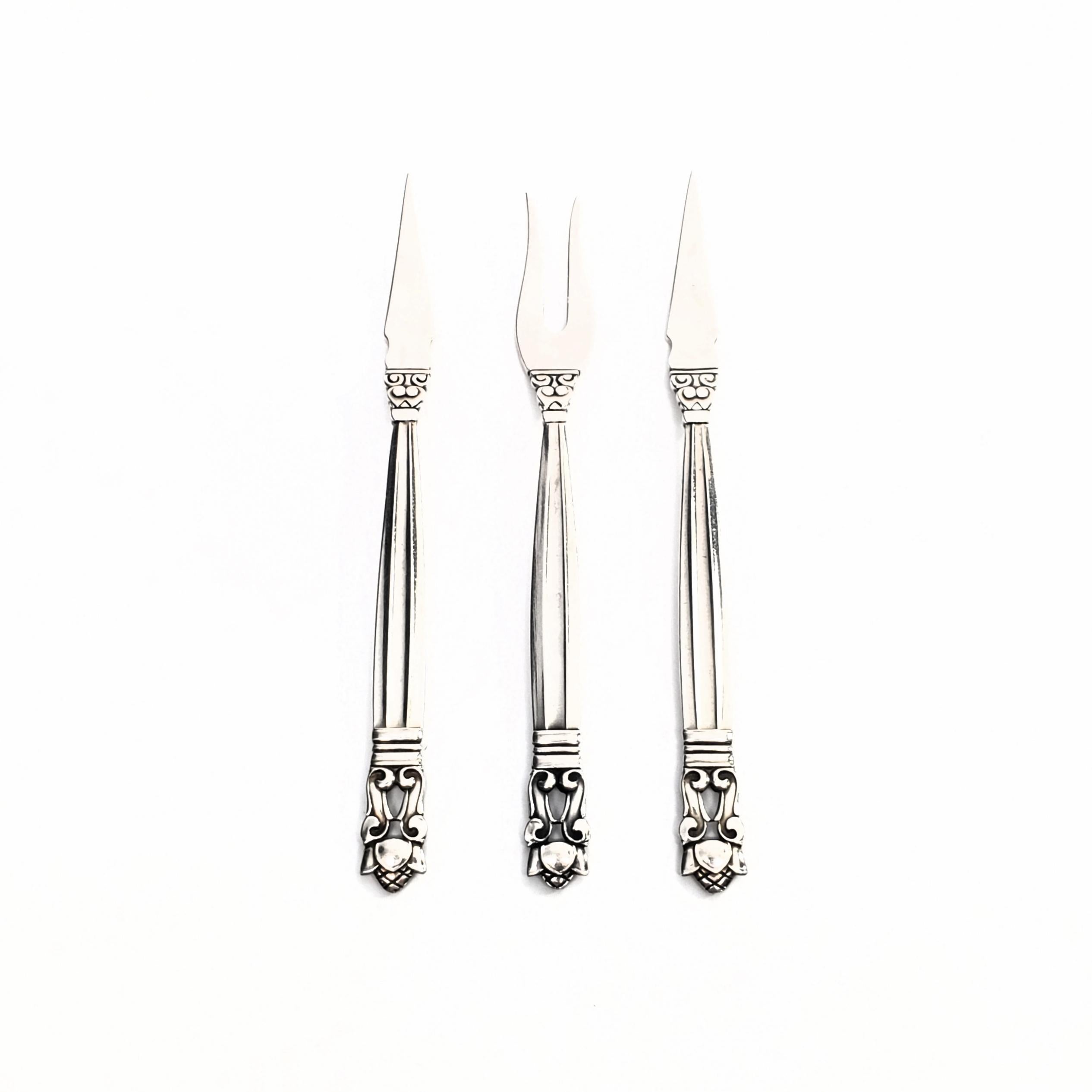 2 sterling silver nut picks and 1 sterling silver lemon fork from Georg Jensen in the Acorn pattern, circa 1915-1919.

The Acorn pattern was introduced in 1915 as a collaboration between Georg Jensen and designer Johan Ronde. The Acorn pattern,