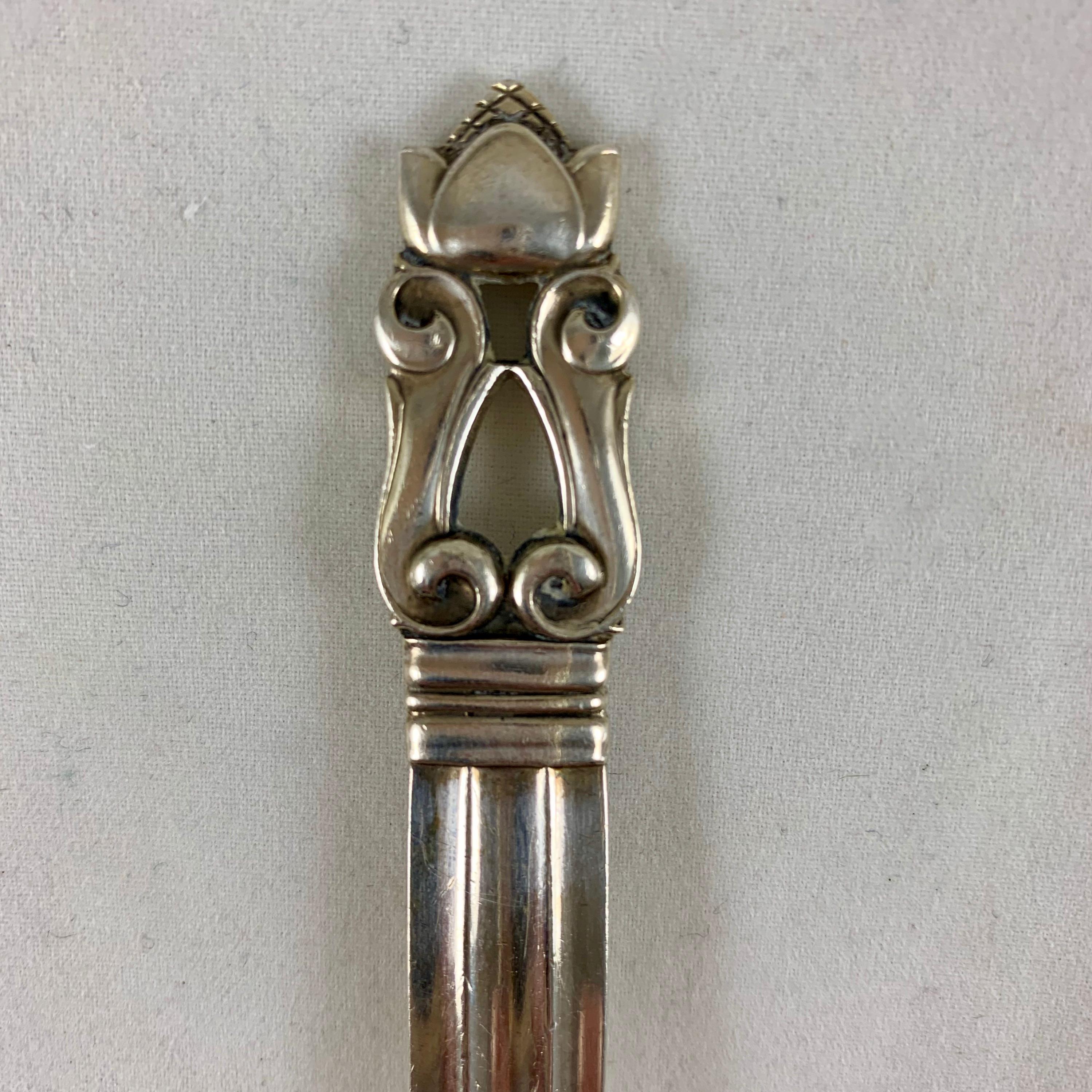 A sterling silver serving spoon in the Classic Acorn pattern.

Designed by Johan Rodhe for Jensen and introduced in 1915, the Acorn pattern is iconic of the European Arts & Crafts movement of the early 1900s. Showing the Georg Jensen name in a