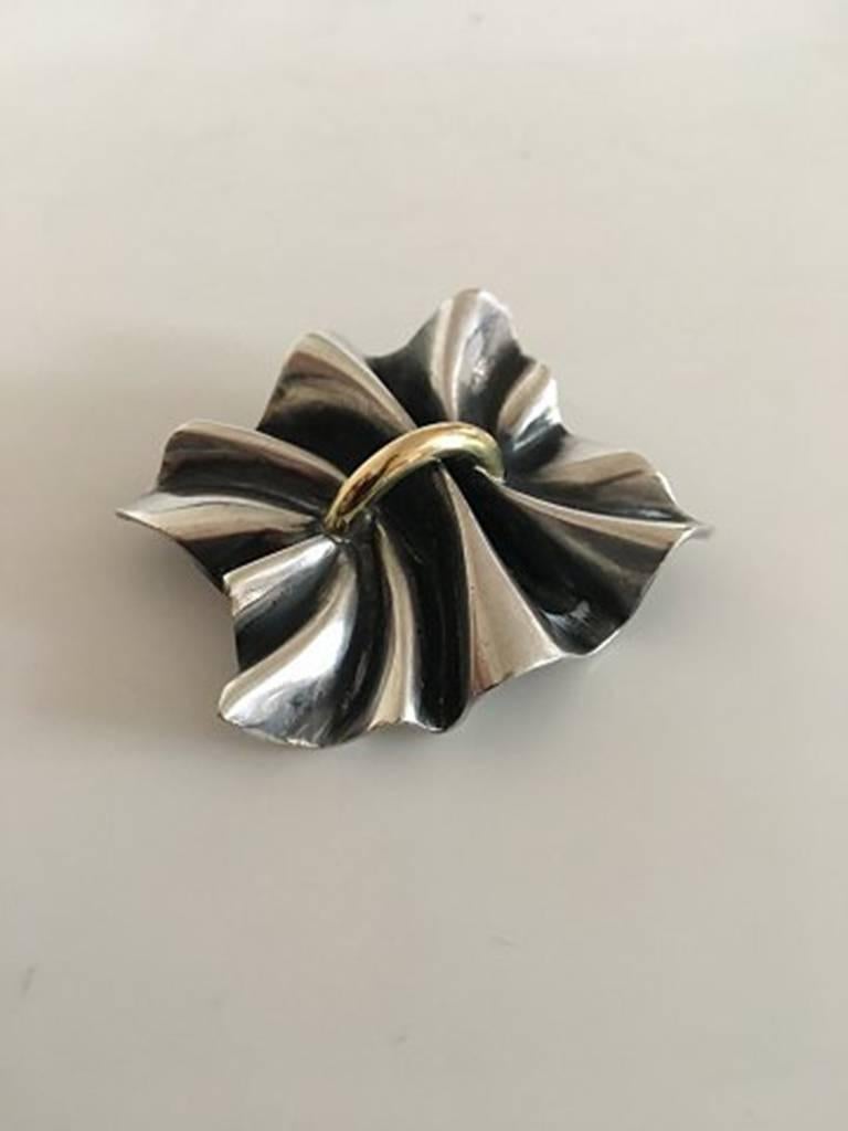 Georg Jensen Sterling Silver and 18K Gold Lene Munthe Brooch No 399. Measures 5 cm / 1 31/32 in. x 3.6 cm / 1 27/64 in. Weighs 36 g / 1.25 oz.