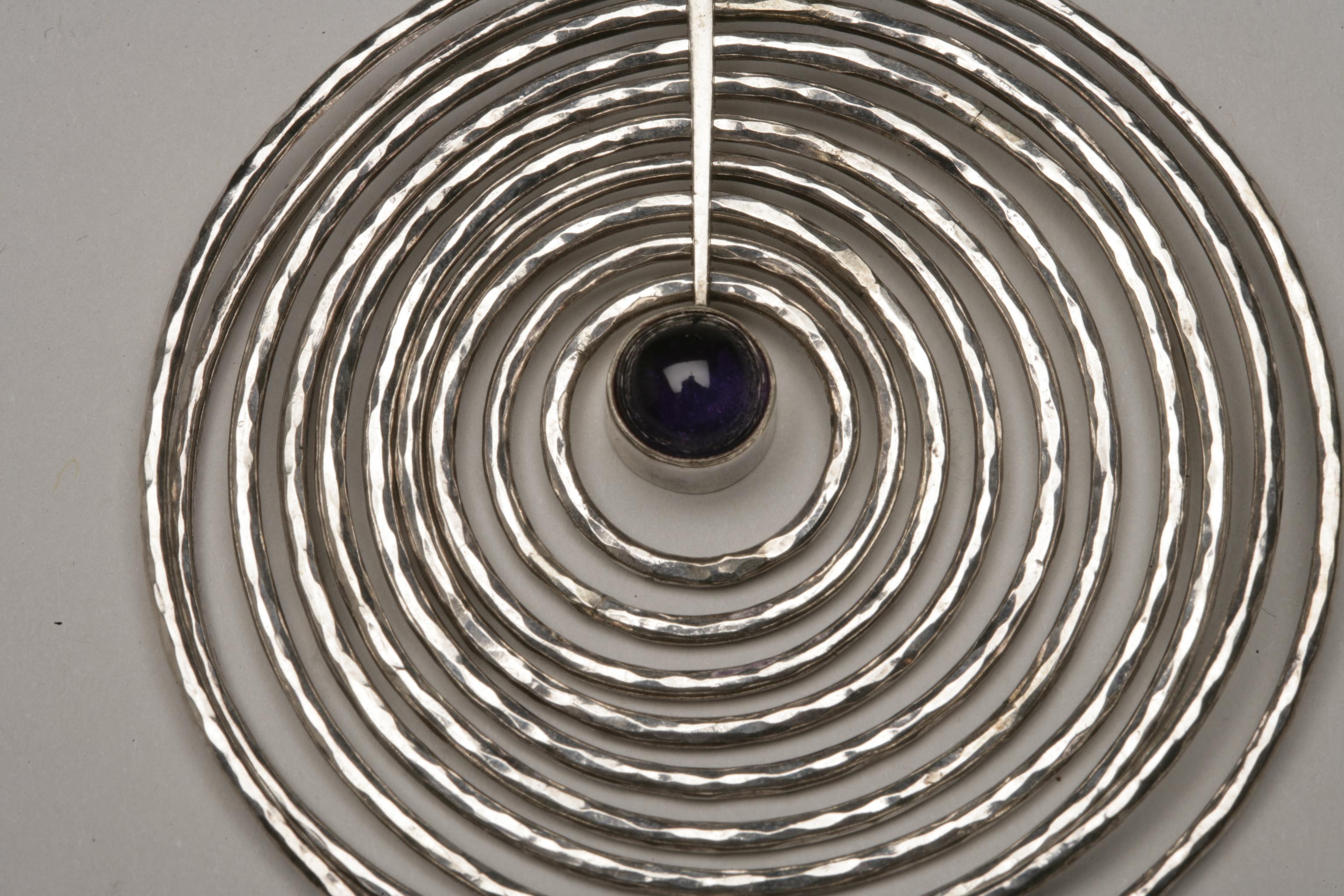 Georg Jensen Sterling Silver and Amethyst Pendant Designed By Bent Gabrielsen, design number 145

Designer: Bent Gabrielsen
Maker: Georg Jensen
Design #: 145
Circa: post 45 (1945-77)
Dimensions: 4.125” X 2.75” X 0.375”
Country of Origin: Denmark