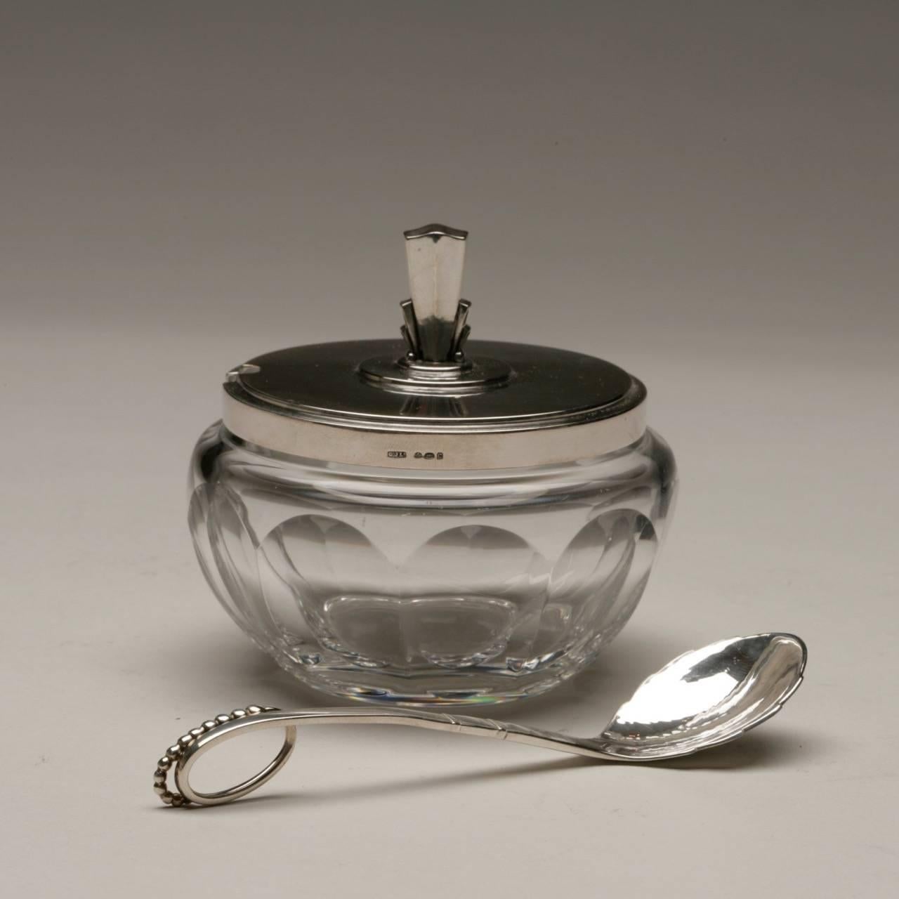 Georg Jensen sterling silver and crystal serving jar, no. 134C by Harald Nielsen

Perfect for serving jam, grated cheese, relish or sugar. Includes Georg Jensen sterling silver spoon (4.75