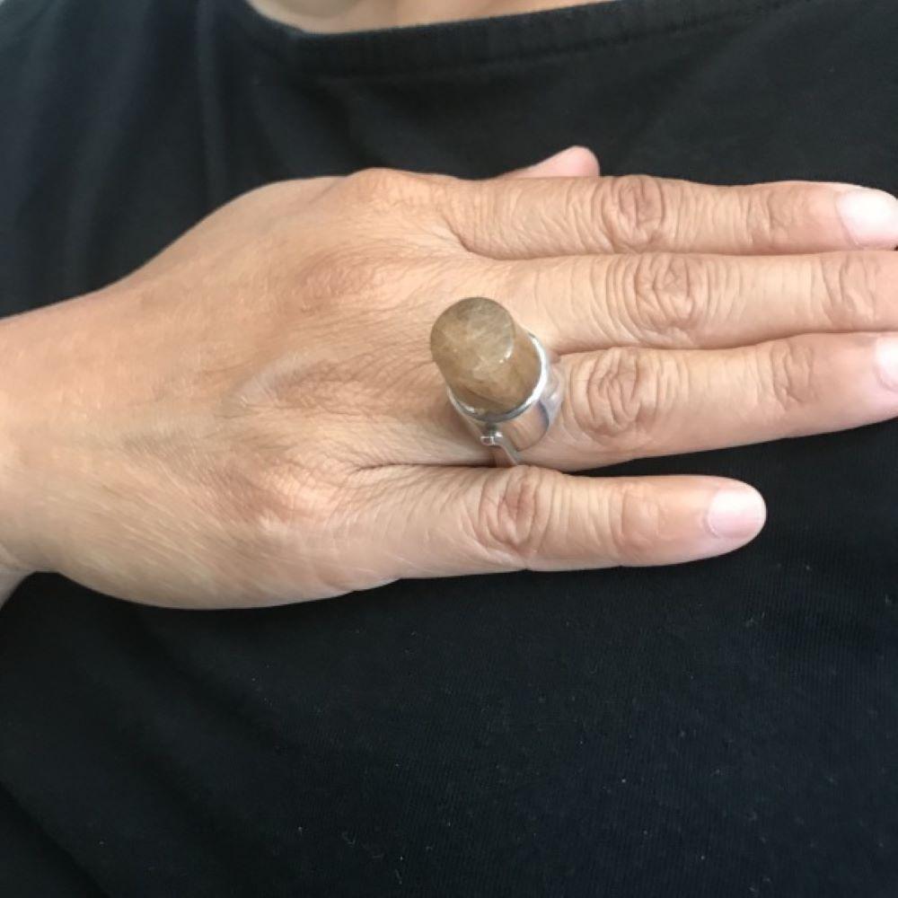 Georg Jensen Ring,  No. 151 By Vivianna Torun with rutilated quartz in a bullet shaped cabochon.

US ring size 5.

Highly sought after design from 1970.  Rich brown rutiles throughout.

Complimentary ring box included.

Designer: Vivianna