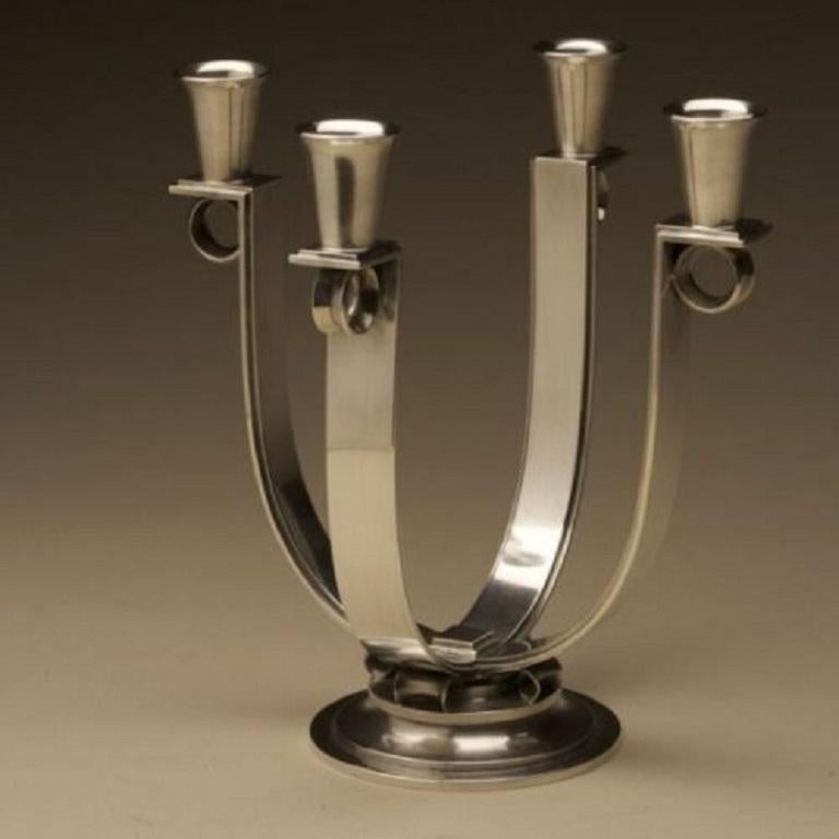 Georg Jensen

Georg Jensen very rare Art Deco candelabra, no. 623B.

Pair of four branch Art Deco rare candelabra designed by Oscar Gundlach-Pedersen in 1937. Features a sturdy, step-up base and strong and sleek arms topped with 