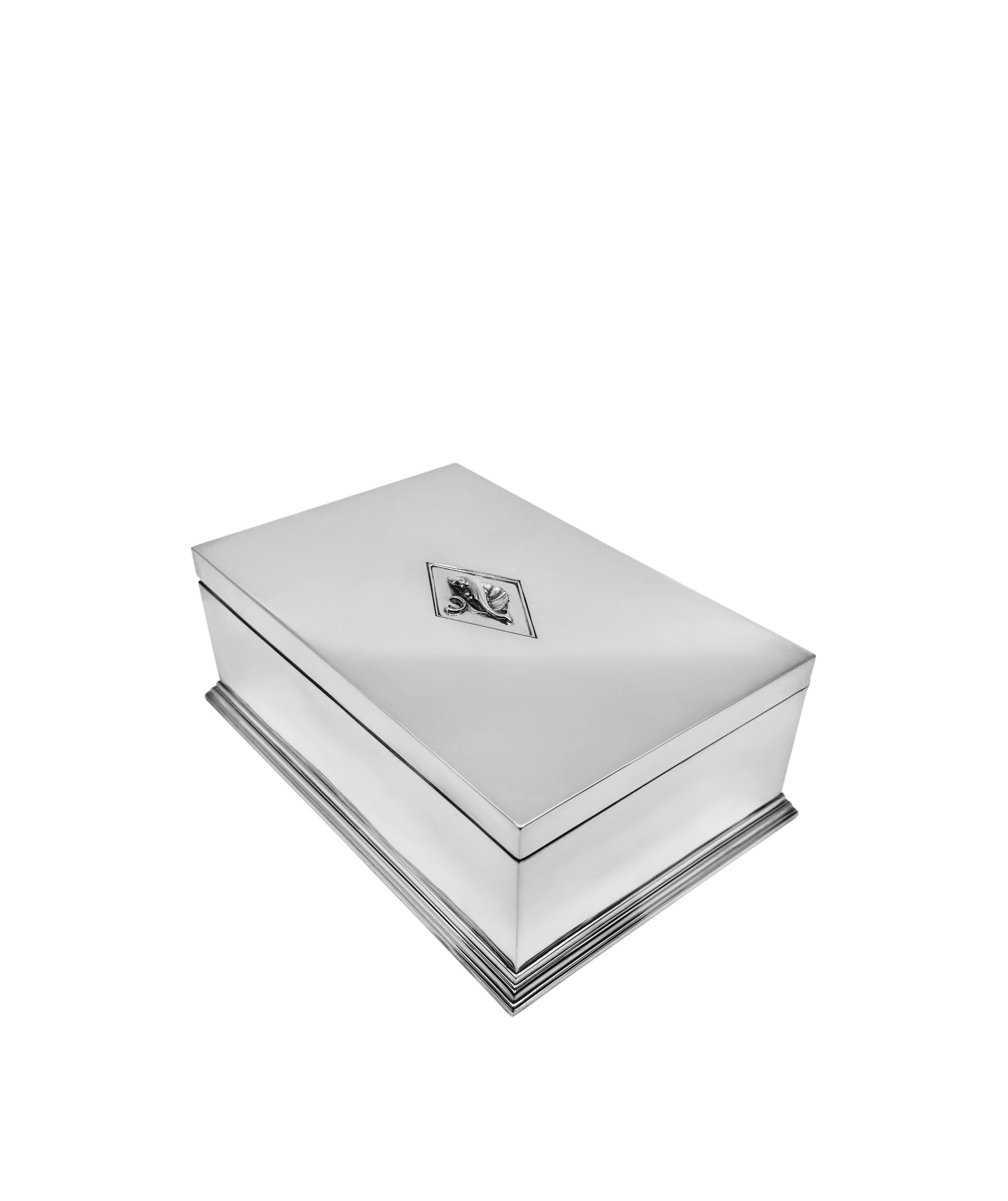 A Large early Georg Jensen sterling silver art deco box design #257 by Harald Nielsen in 1923. The box showcases exquisite craftsmanship. A generously sized hinged rectangular piece, it features a hand-hammered surface and subtle adornments like a