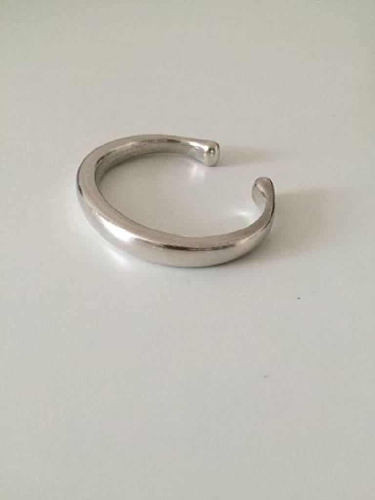 Georg Jensen Sterling Silver Bangle Bracelet #215. Measures 6 cm / 2 23/64 in. x 5 cm / 1 31/32 in. inner measurements. Weighs 82 g / 2.90 oz.