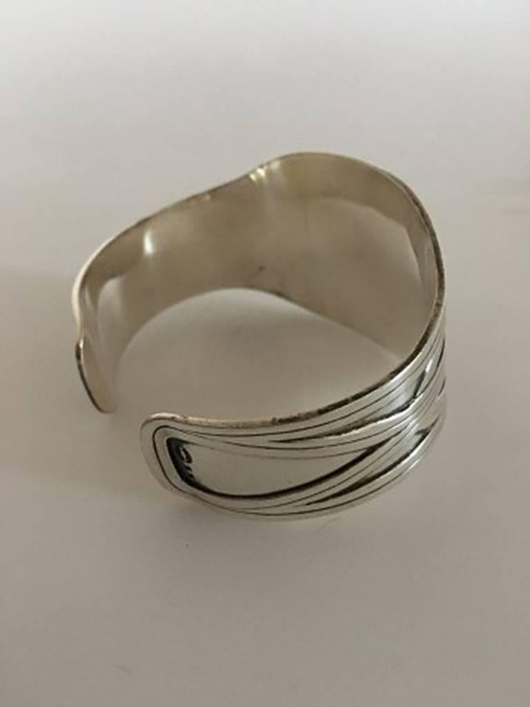 Georg Jensen Sterling Silver Bangle/Bracelet #55. Measures: 4 cm / 1 37/64 in. at it widest point, Inner Diameter. 6.5 cm /2 9/16 in.. Weighs 57 g / 2.00 oz. Manufactured after 1945 and is in great condition.