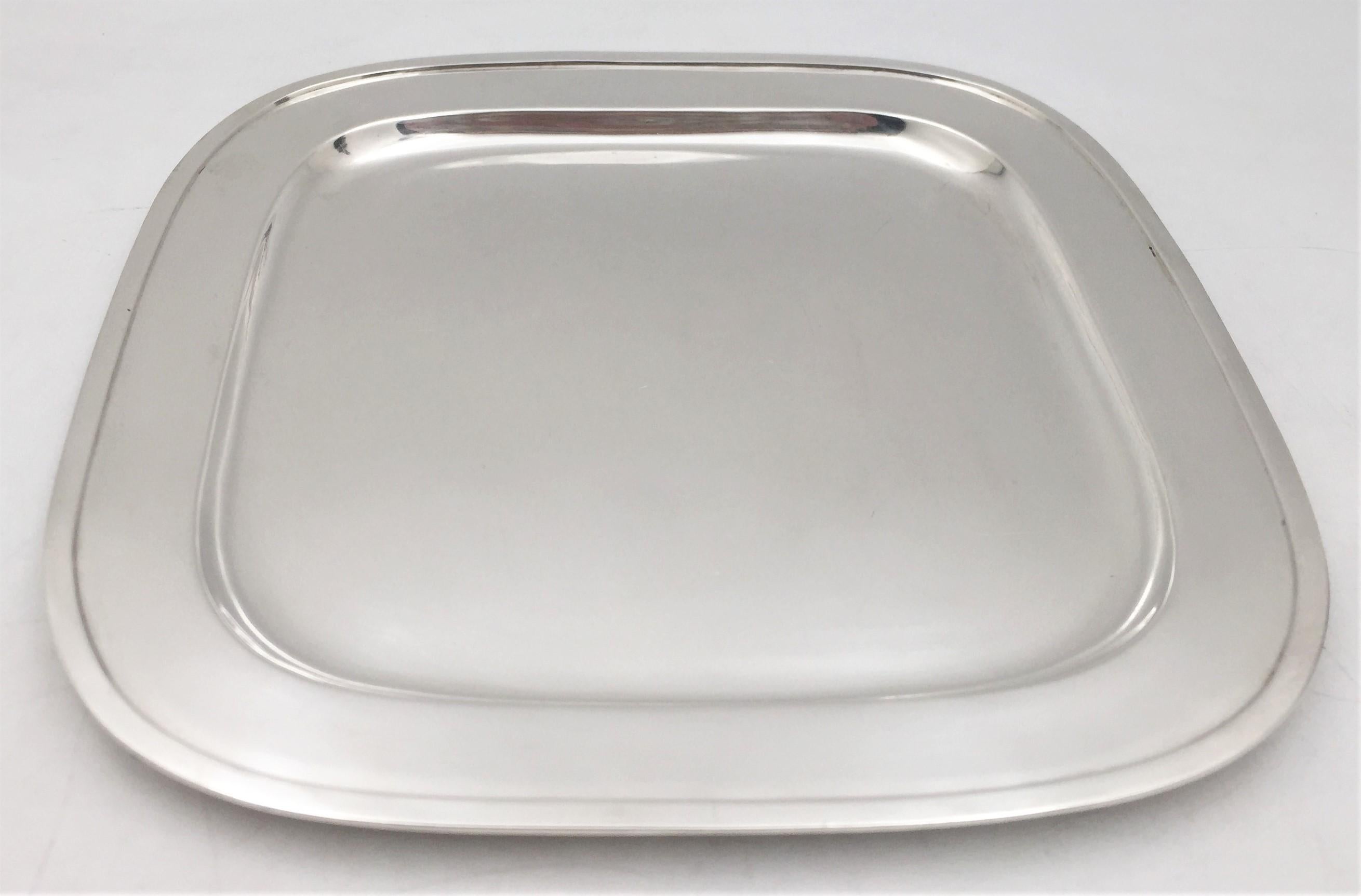 Georg Jensen, sterling silver bar tray in Mid-Century Modern style with beautiful geometric design, measuring 11'' by 11'' by 1/3'' in height, weighing 21.9 troy ounces, and bearing hallmarks as shown. 

Danish silversmith George Jensen set up his