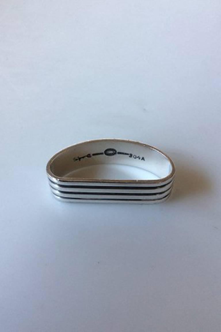 Georg Jensen sterling silver Bernadotte napkin ring #304A. Measures 5.6 x 2.8 x 1.5 cm / 2 13/64 in. x 1 7/64 in. x 0 19/32 in.