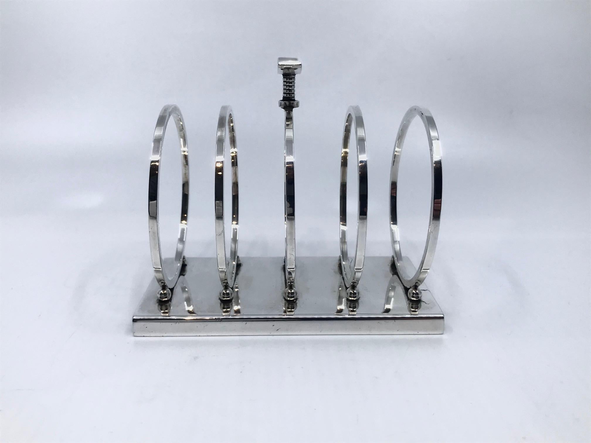 This is a rare sterling silver Georg Jensen toast rack, design #824 by Sigvard Bernadotte from circa 1937. Light, elegant and functional design, the essence of Bernadotte’s design language.

Additional information:
Material: Sterling silver
Styles: