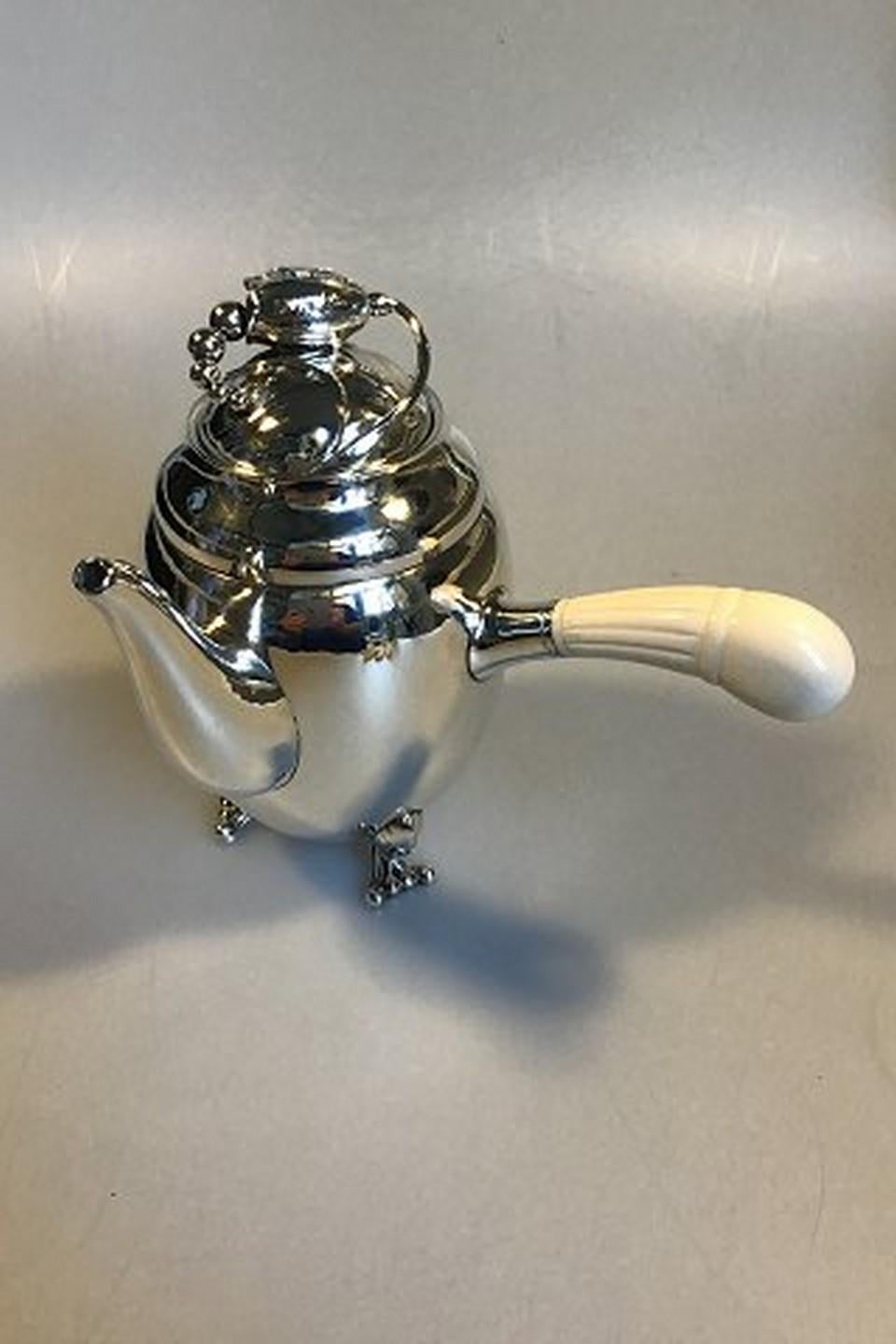 Georg Jensen sterling silver blossom coffee pot No. 2D.
Measure: 21 cm H (8.26