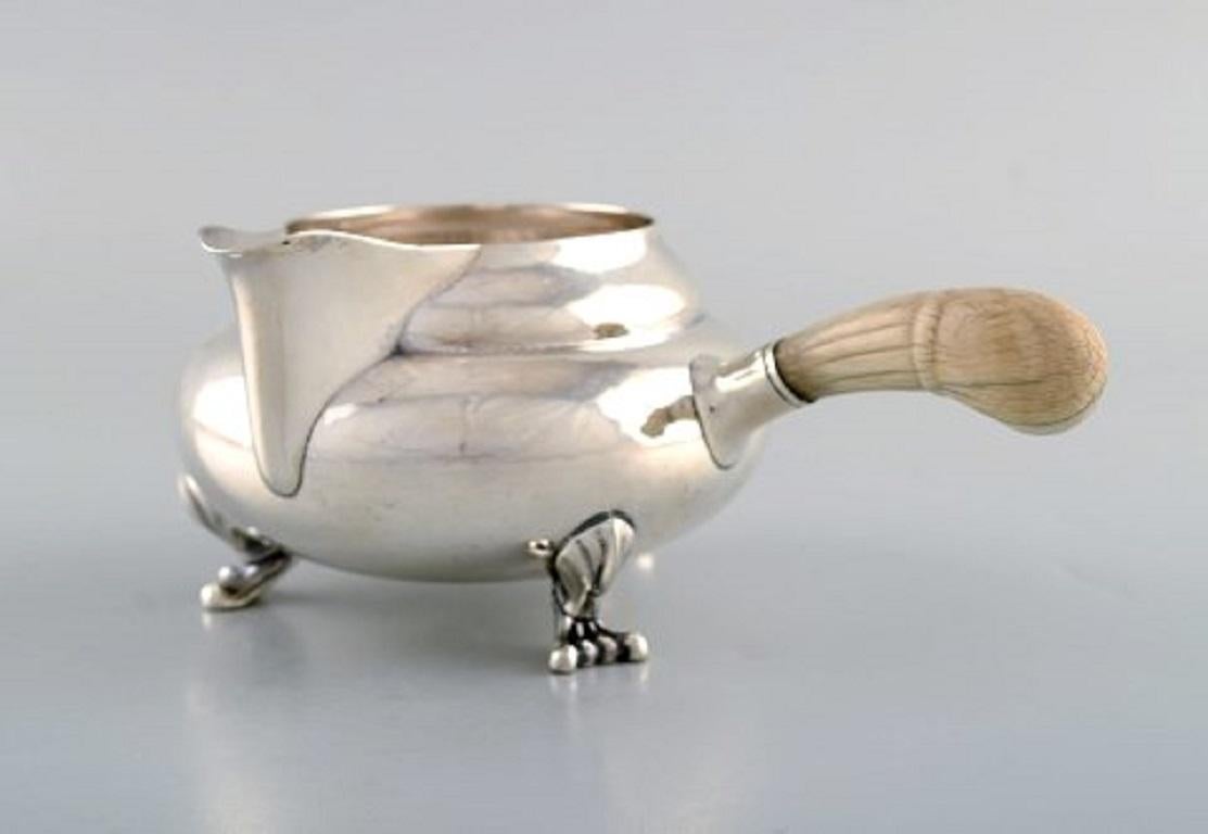 Georg Jensen sterling silver blossom large cream jug number 2D.
Measures 14 cm. long includes handle. 7 cm. high.
Weight 229 grams.
Stamped.