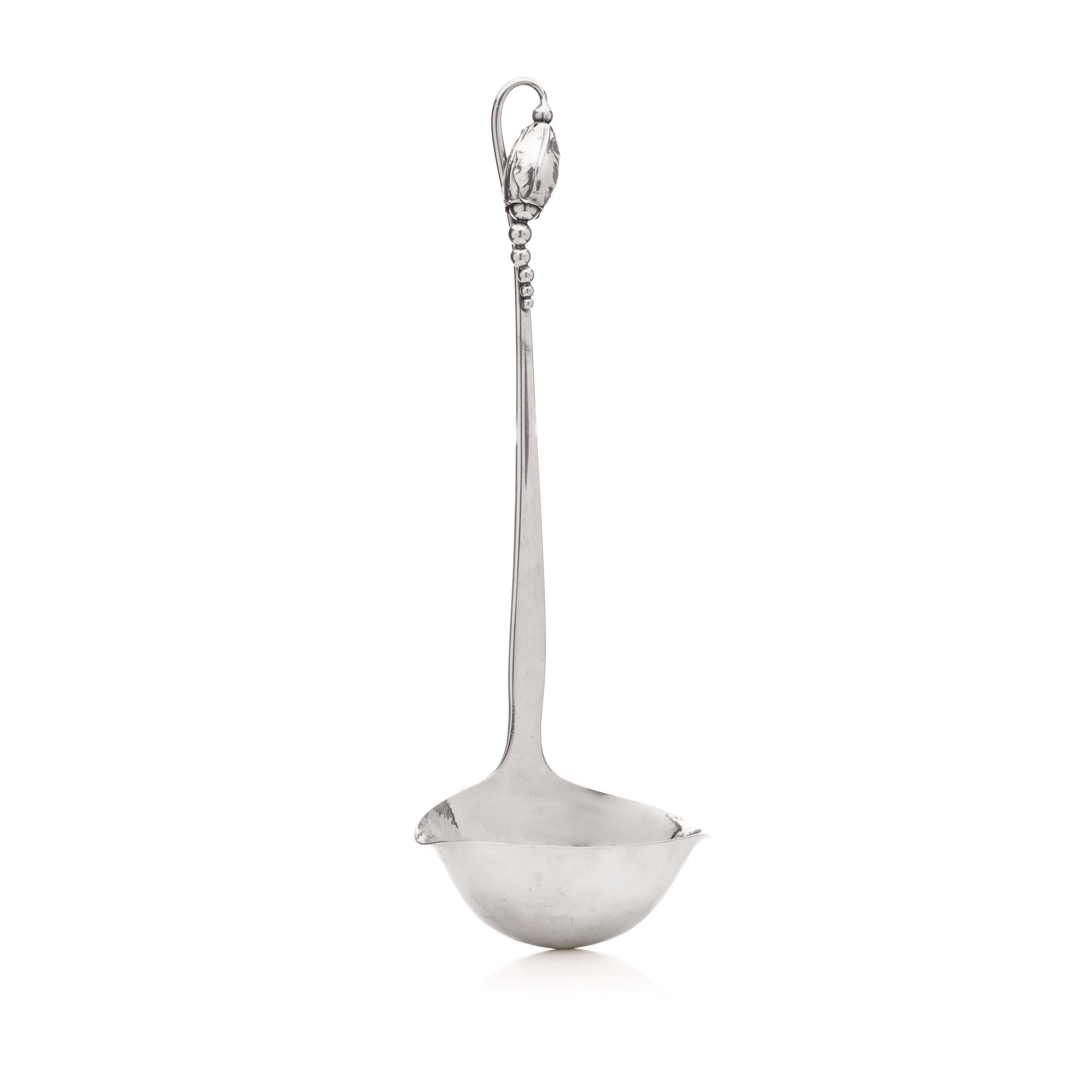 Georg Jensen Sterling Silver Blossom No 84 Cream ladle. 

Dimensions:
Length: 33.5 cm 
Widest point: 11.5 cm 
Weight: 231  grams in total 

Condition: The item is pre-owned, and in excellent condition overall. 