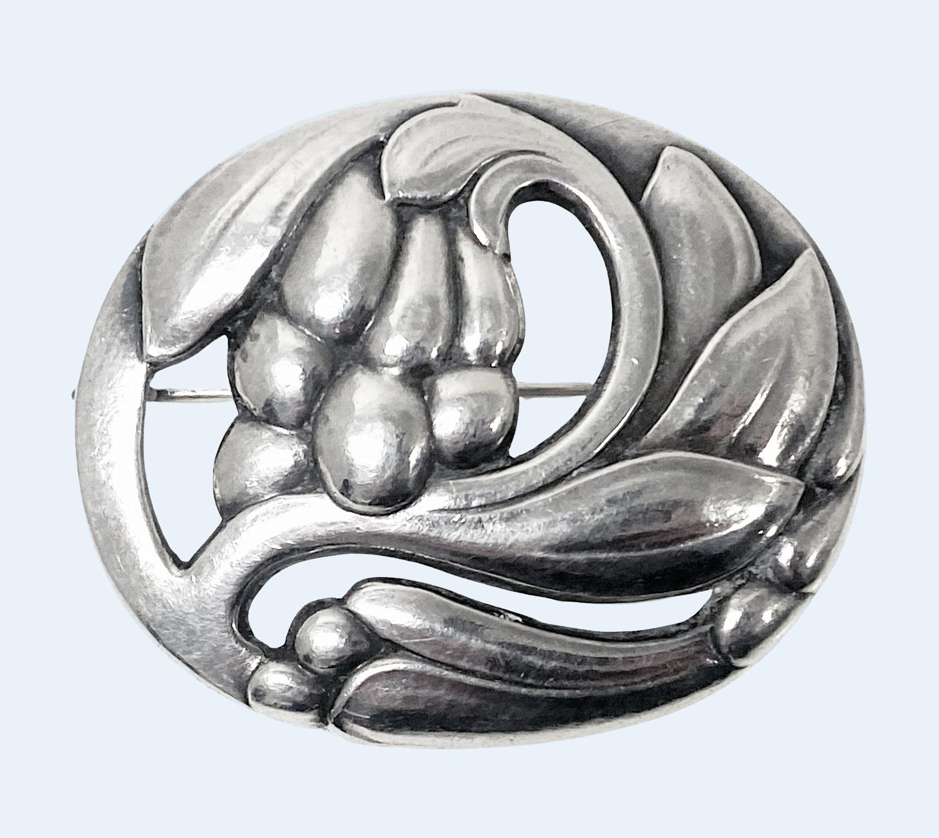 Georg Jensen Sterling Silver Blossom Pin C.1940 No 65. Stylised blossom floral pin brooch. Measures approximately 2.00 x 1.50 inches. Weight:15.80 grams. Full Georg Jensen Sterling Denmark GI in box and design Number 65 to reverse. Ref: P130 Georg