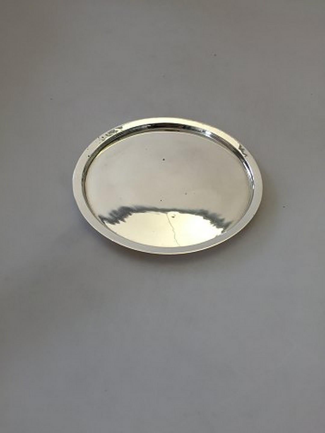 Georg Jensen sterling silver bottle coaster. Measures 13.8cm and is in good condition.
Item no.: 188535.