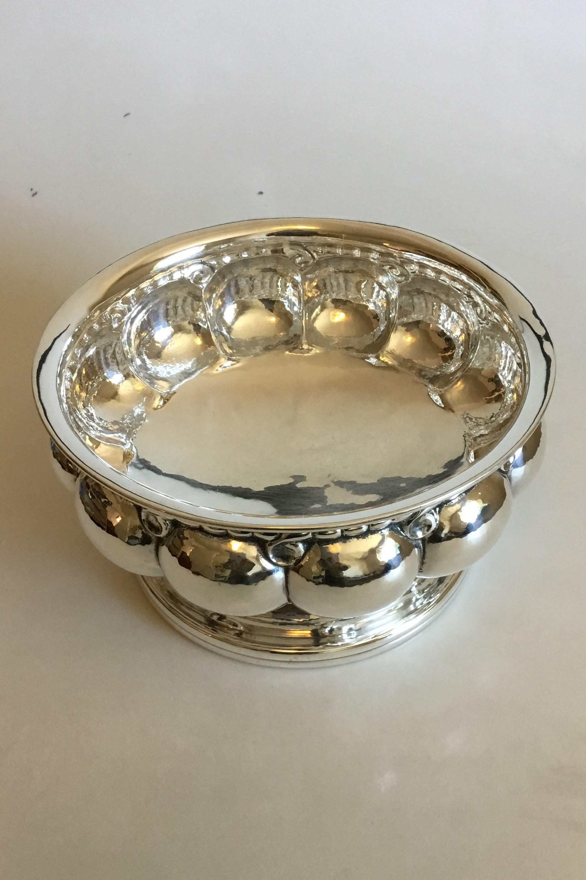 Georg Jensen sterling silver bowl No 16. Measures: 12.3 cm / 4 27/32 in. x 23.5 cm / 9 1/4 in. diameter. Weighs 783 g / 27.60 oz.
With import marks for London, 1926.