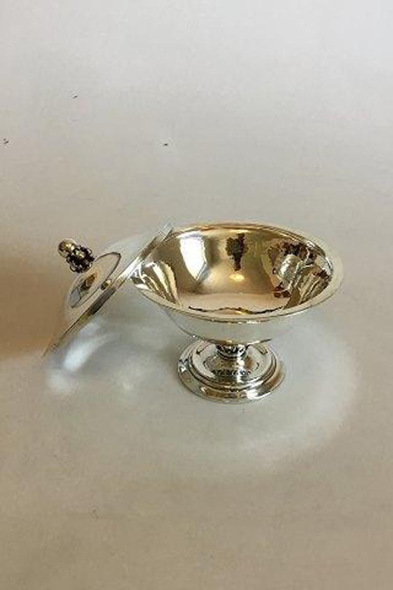 Georg Jensen sterling silver bowl with cover No 180A. 

Measures 12 cm / 4 23/32 in. diameter. x 12 cm / 4 23/32 in. high. Weighs 298 g / 10.50 oz.