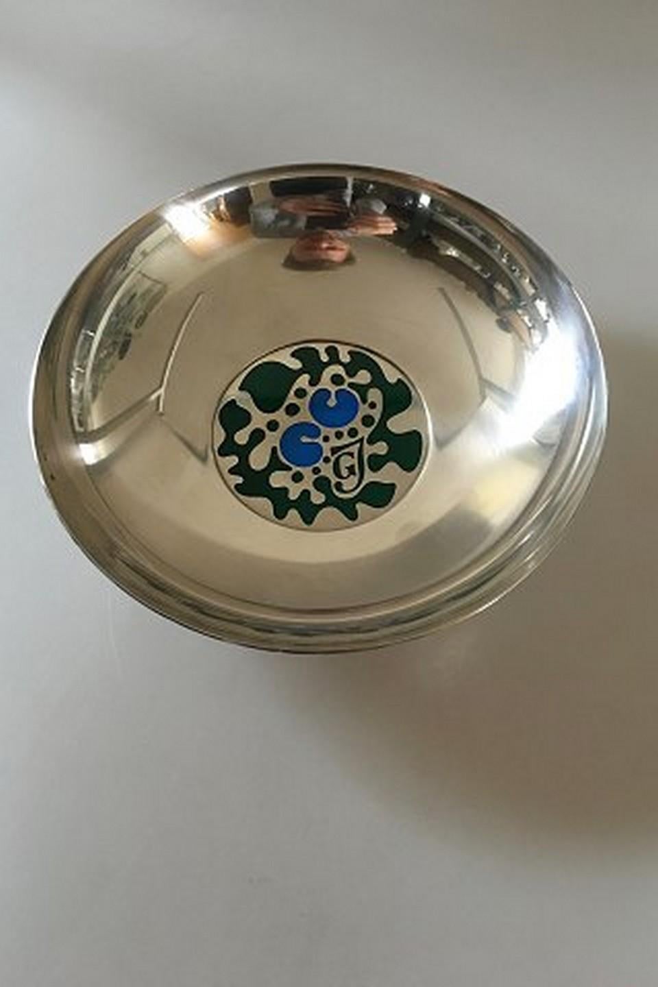 Georg Jensen sterling silver bowl with enamel.

Designed by Henning Koppel in 1979 for Georg Jensen 75th Jubilee.

This one is 98 out of 200 made.
Measures: 19 cm diameter (7 31/64
