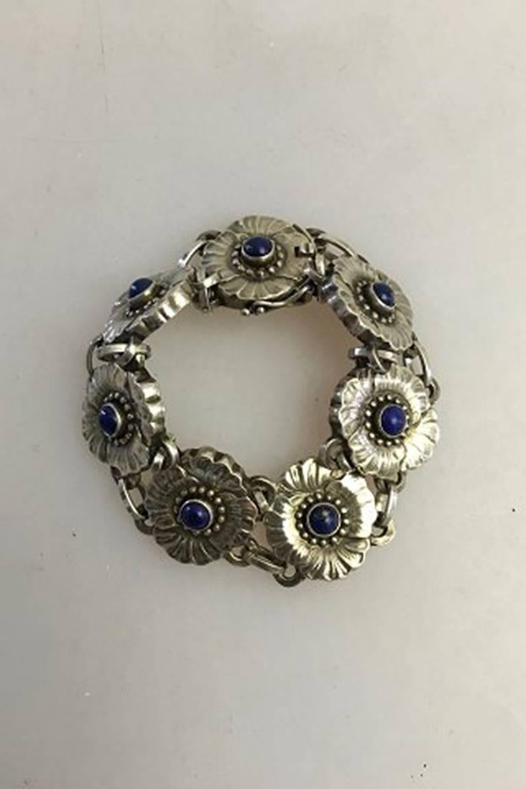 Georg Jensen Sterling Silver Bracelet No 36 with Lapis Lazuli. From after 1945. Consists of 7 Links.

Measures 17 cm / 6 11/16 in. Weighs 34 g / 1.15 oz.