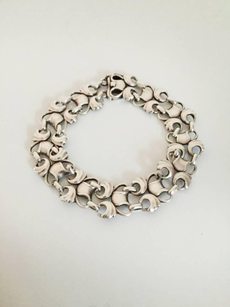 Georg Jensen Sterling Silver Bracelet No 79. Made with marks from 1933-1944

Measures 20.5 cm / 8 5/64 in. x 1.3 cm 0 33/64 in. wide.
Weighs 23 g / 0.85 oz.