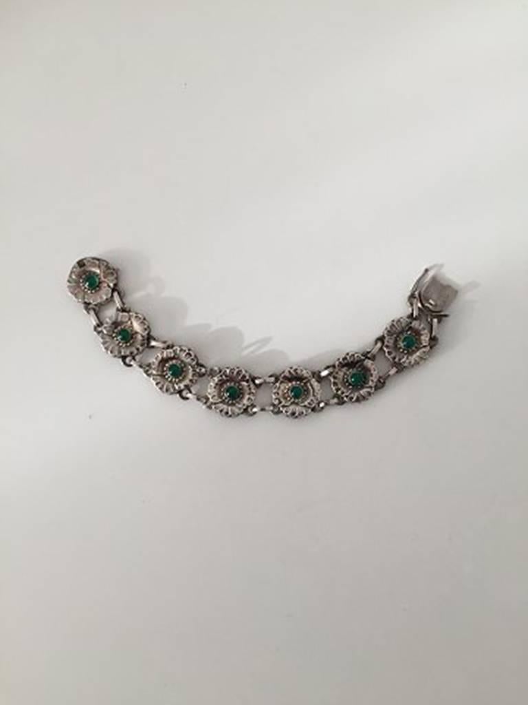 Georg Jensen Sterling Silver Bracelet with Green Stones No 36. Measures 19 cm and is in perfect condition. Weighs 32.8 g / 1.15 oz.