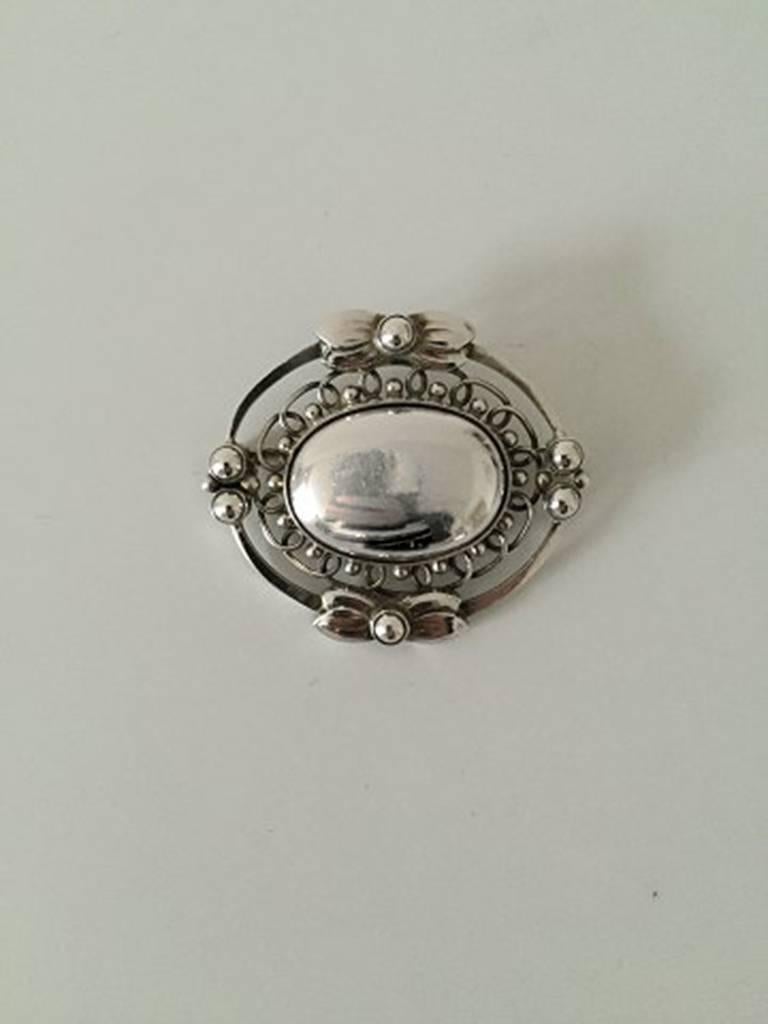 Georg Jensen Sterling Silver Brooch #91. Measures 4,1cm / 1 3/5 in. high and 4,8cm / 1 9/10 in. wide. Weighs 18g / 0.65oz
