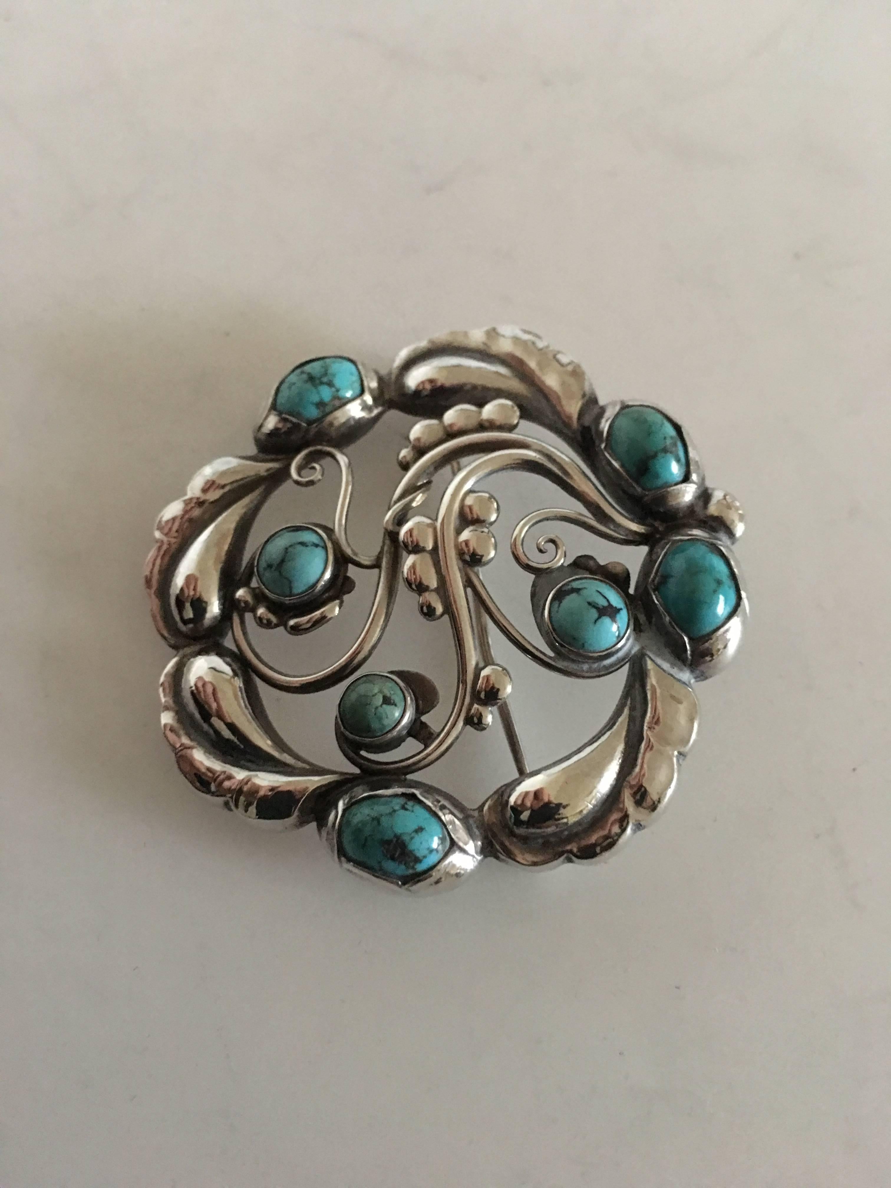 Georg Jensen Sterling Silver Brooch No. 159 ornamented with Turquoise. 4.6 cm diameter (1 13/16