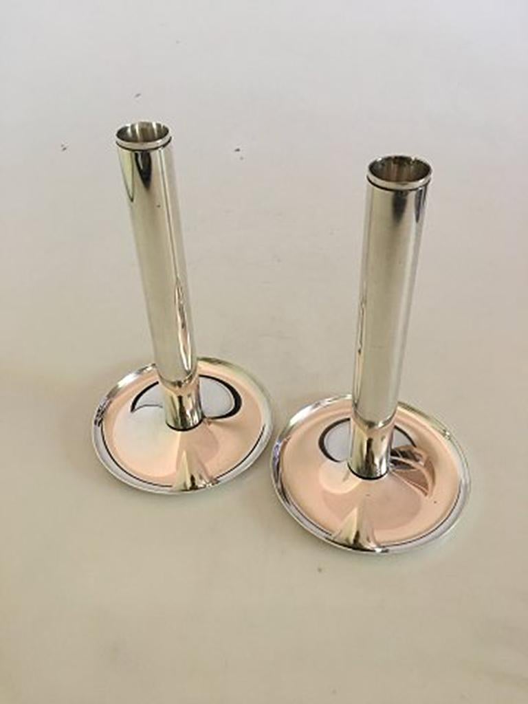 Georg Jensen sterling silver candlesticks #1138 by Soren Georg Jensen. Measures: 19 cm H (7 31/64 in). Feet 11 cm diameter (4 21/64 in). One stick weighs 218 grams / 7.70 oz. In perfect condition.