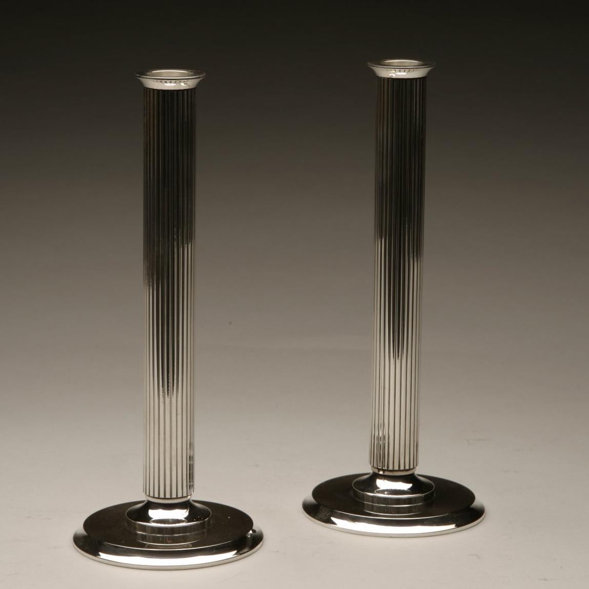 Price is for the pair but these candlesticks can also be ordered individually.

The stem of this candlestick is a tube which has been pulled through a so-called draw plate which makes the lines. The base is an assemblage of four individually made