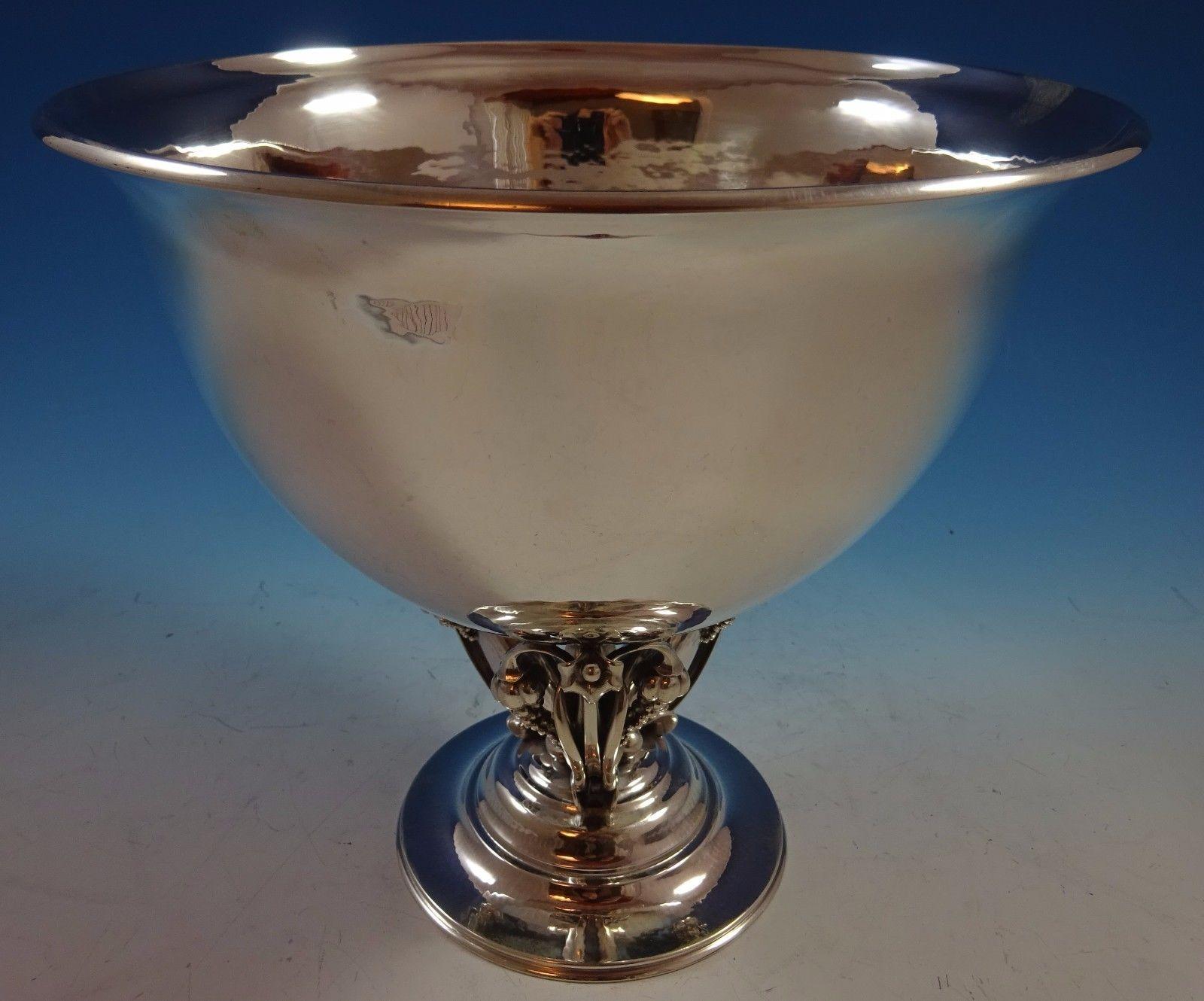 Gorgeous Georg Jensen sterling silver centerpiece bowl featuring a base made of 3-D blossoms with hanging fruit and beads. It has GI marks for 1910-30 and #468A. The piece measures 8 1/8