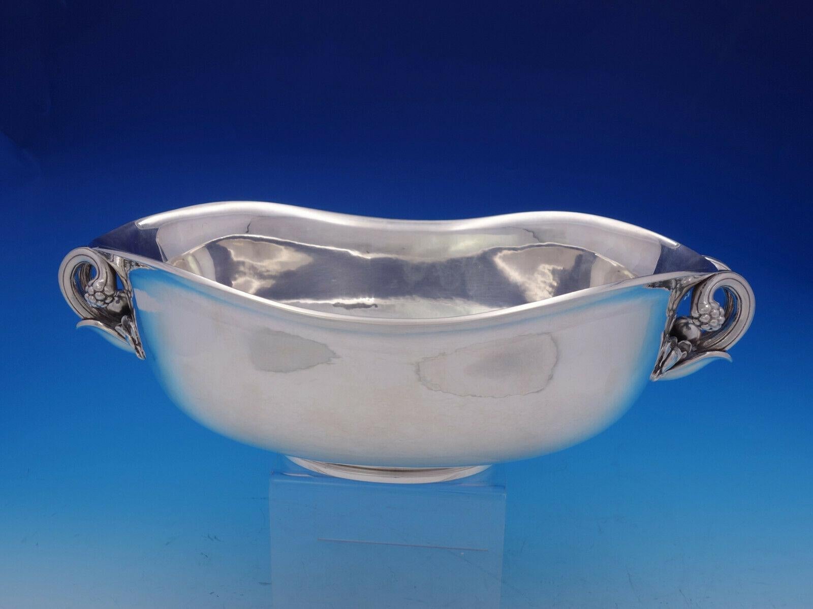 Georg Jensen

Superb Georg Jensen large oval sterling centerpiece bowl #650A designed by Harald Nielsen. This exquisite, oval shaped centerpiece bowl has a unique bowed shape and is double handled. Each cast and applied handle has intricate