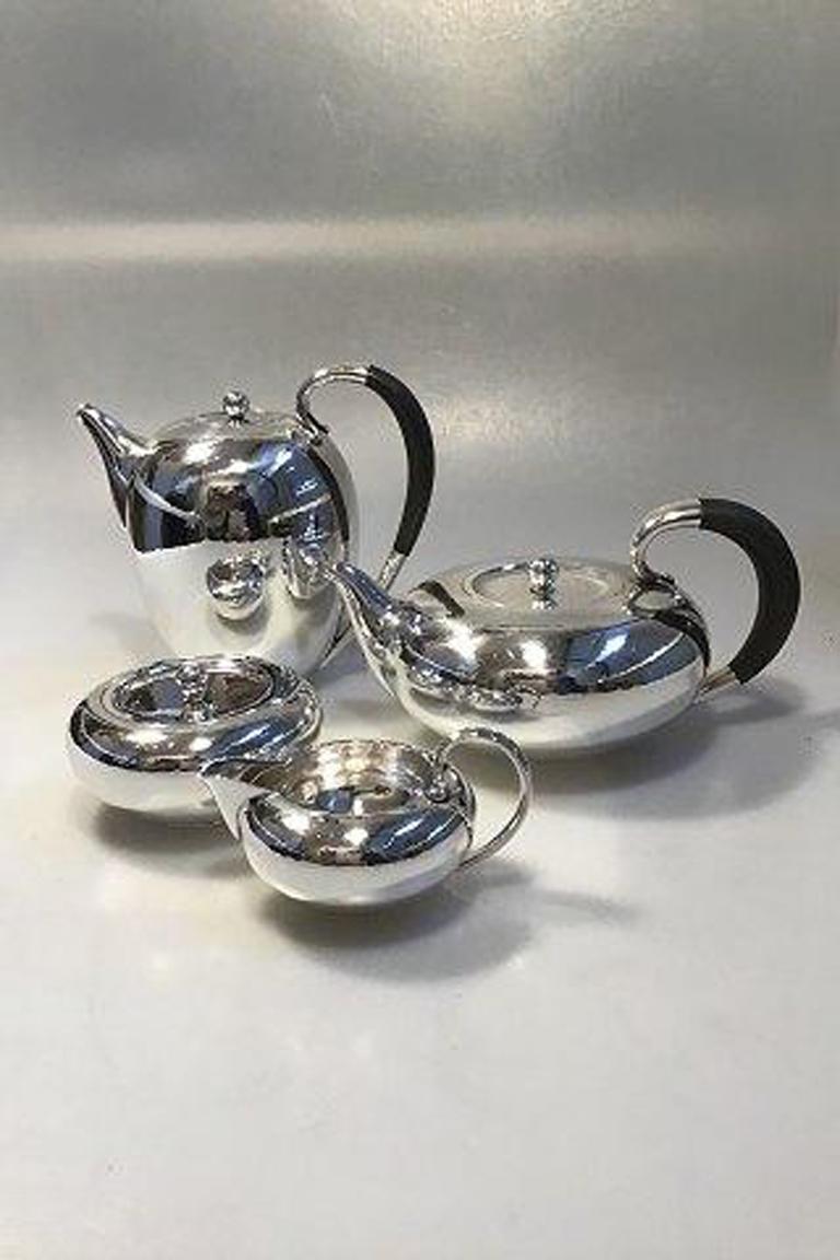 Georg Jensen sterling silver coffee-tea set No 787

The set comprises:
Coffee Pot H 17 cm(6 11/16 in) Weight 599.4 gr/21.14 oz
Tea Pot H 11.5 cm( 4 17/32 in)Weight 692.3gr/24.42 oz
Creamer H 6.5 cm(2 9/16 in)Weight 168.5 gr/5.91 oz
Sugar Bowl