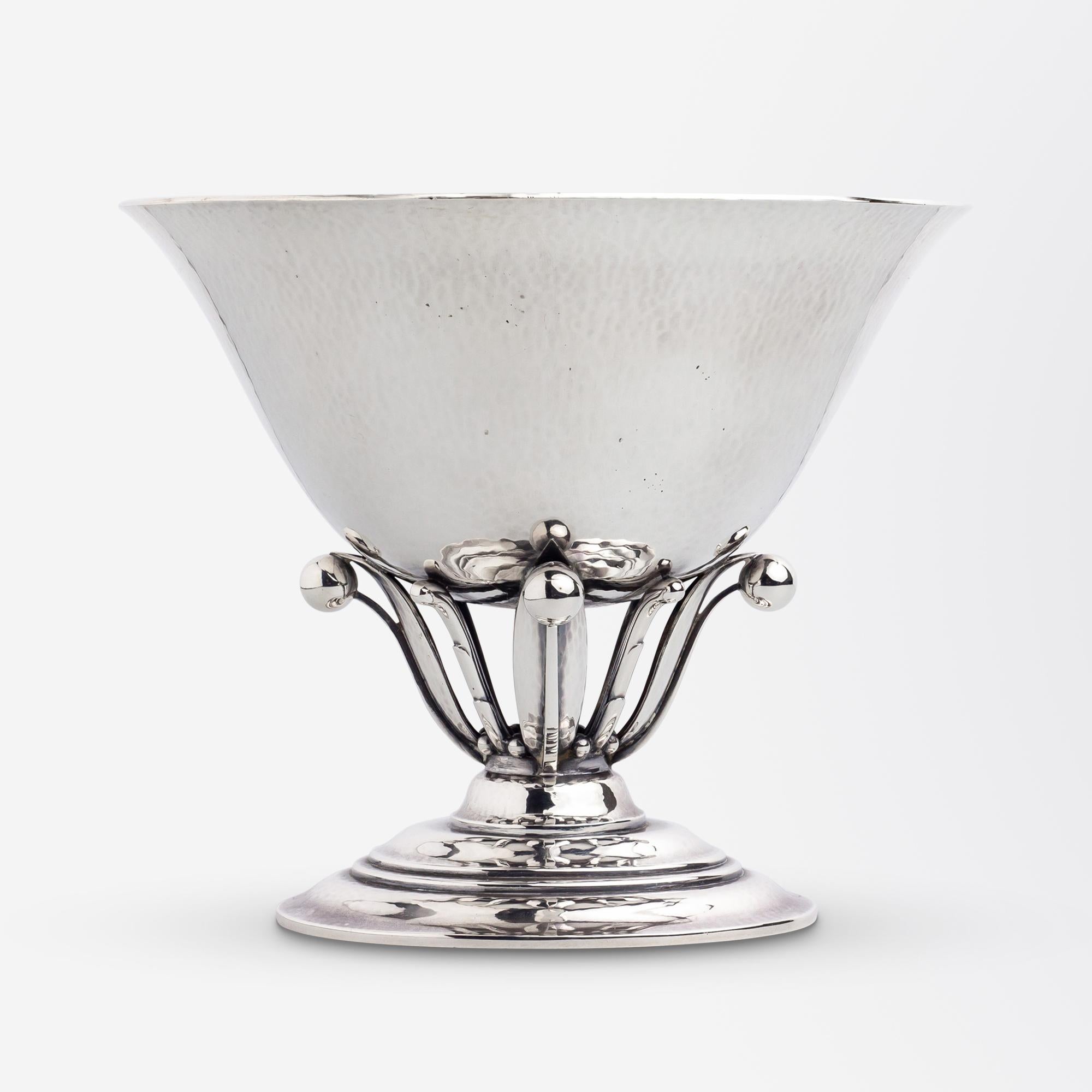 This rather beautiful sterling silver comport was made by Georg Jensen in a design by the famed craftsman Johan Rohde. The piece was first designed between 1912 and 1915, however this example has post 1945 Georg Jensen hallmarks. Johan Rohde